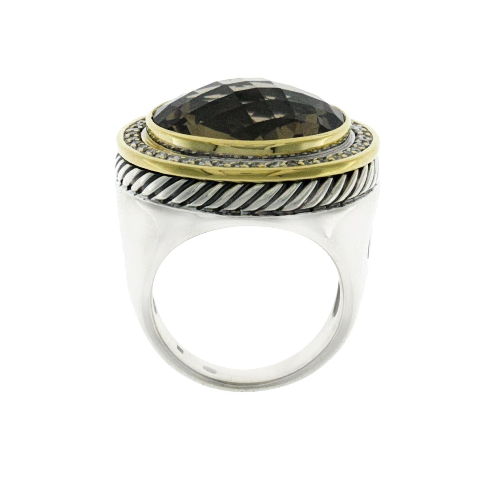100% Authentic, 100% Customer Satisfaction

Top: 25 mm

Band Width: 5.5 mm

Metal: 925 Sterling Silver & 18K Gold

Size: 7

Hallmarks: DY 925 750

Total Weight: 23.6 Grams

Stone Type: Diamonds & Smoky Topaz

Condition: Pre Owned in Great