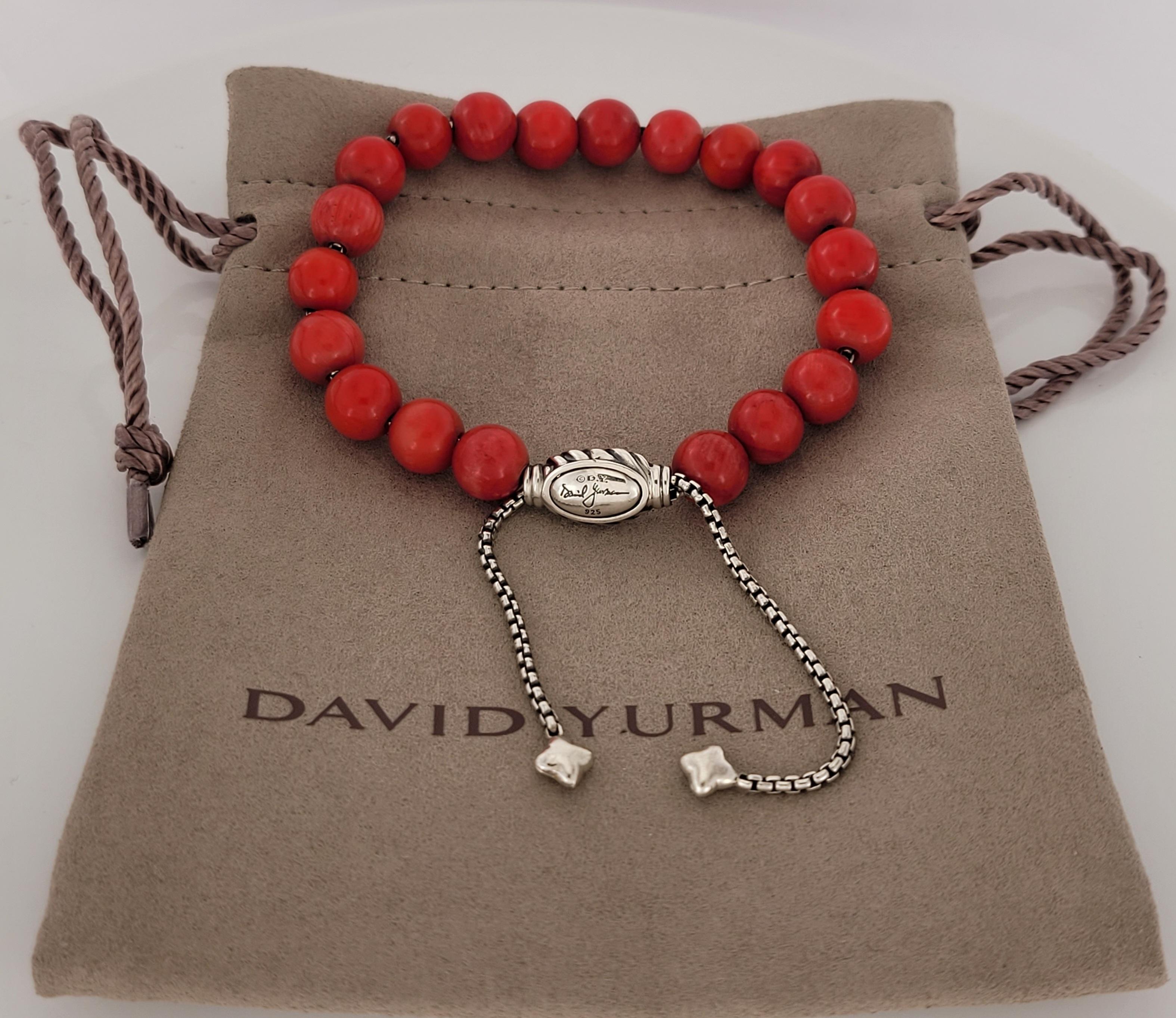 Brand David Yurman 
Sterling Silver 925
Red Coral bead bracelet
Material Sterling Silver 925
Onyx Width 8mm
Adjustable length 
Comes with David Yurman pouch
Condition Never worn
Retail Price: $450    