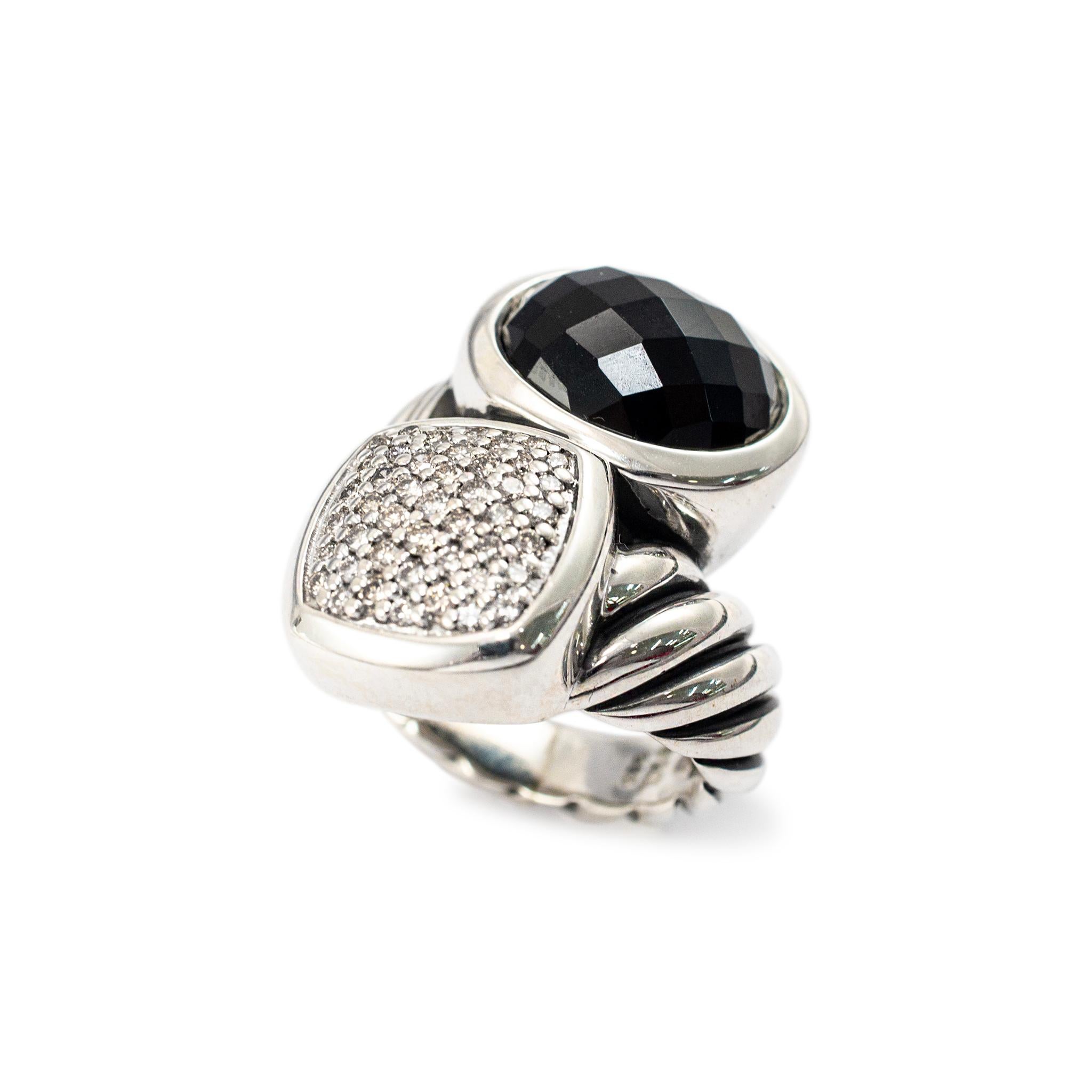 Brand: David Yurman

Gender: Ladies

Metal Type: 925 Sterling Silver

Ring Size: 2.5

Width: 24.50 mm tapering to 4.55 mm

Weight: 11.33 grams

One ladies silver diamond and onyx cocktail cluster ring with a half-round shank. The metal was tested