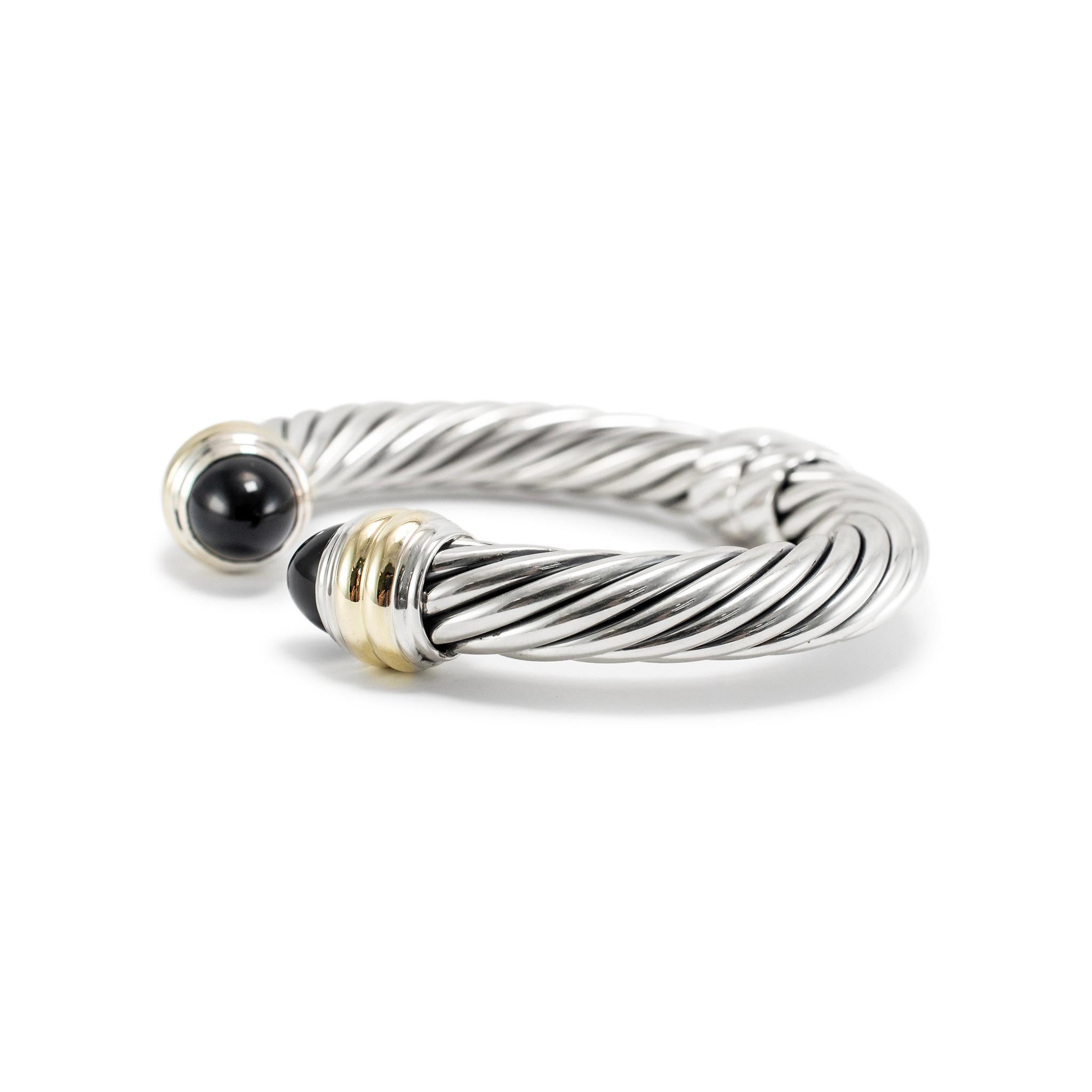 Brand: David Yurman 

Gender: Ladies

Metal Type: 14K Yellow Gold & 925 Sterling Silver

Length: 6.00 inches 

Width: 10.00 mm

Weight: 47.66 Grams

Ladies designer made textured & polished, 14K yellow gold and silver, cuff bracelet. The metals were