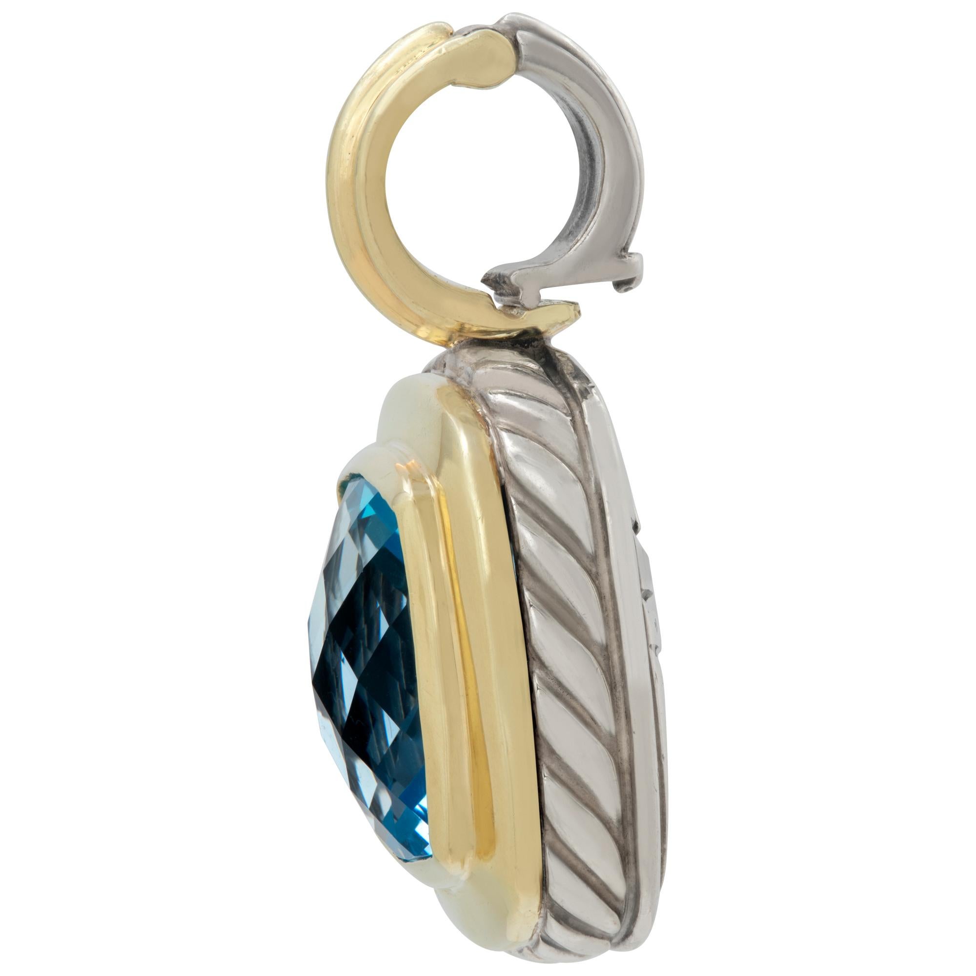 David Yurman Albion blue topaz enhancer in 18k & sterling silver. Hanging length 30.5mm x width 19.5 mm.
