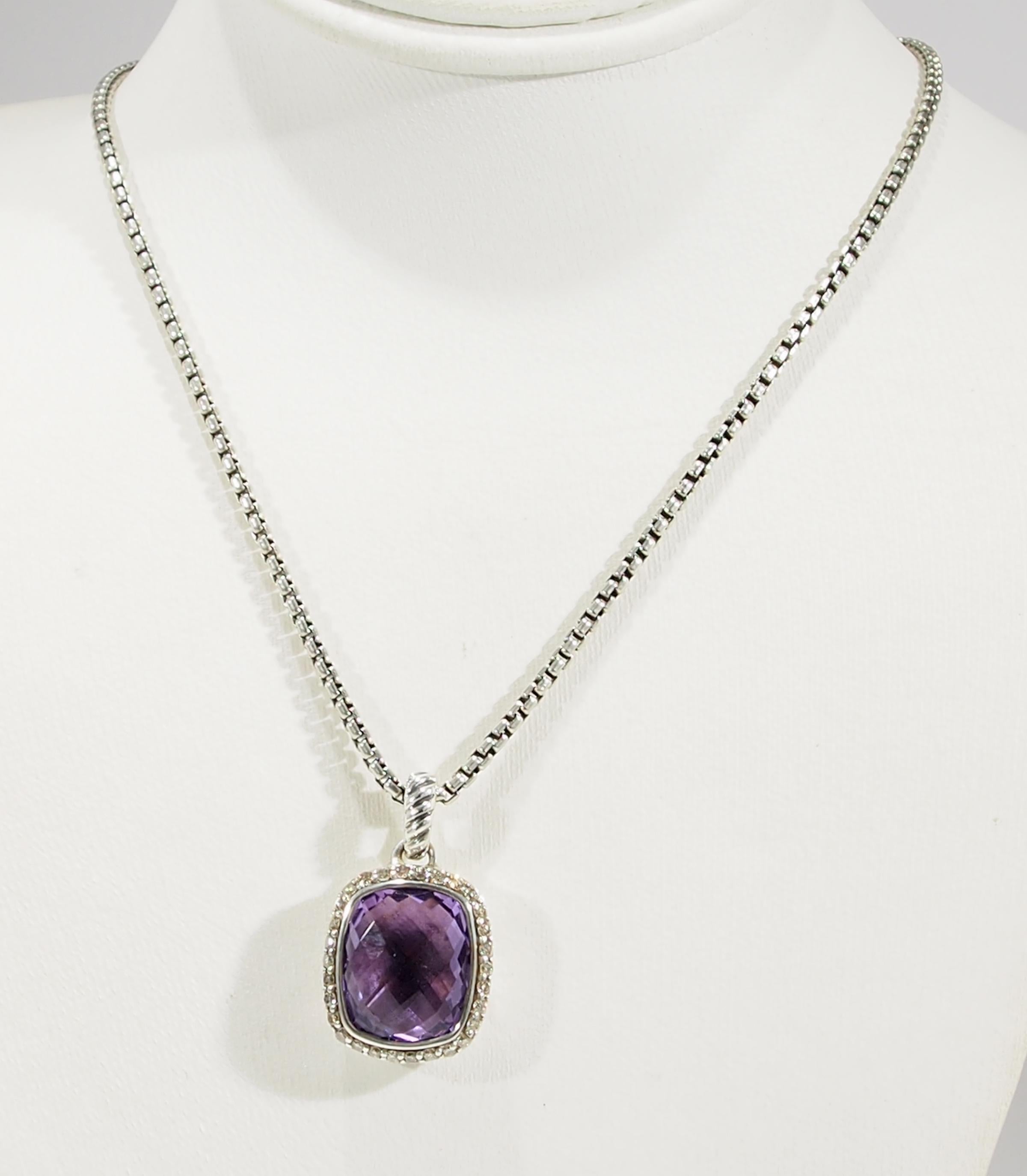 From the well known Jewelry Designer David Yurman, is this favorite Albion Amethyst Pendant With the Chain. The Pendant is with the 11mm Amethyst surrounded by (30) Round Brilliant Cut Diamonds, approximately 0.23ctw. This Pendant includes the David