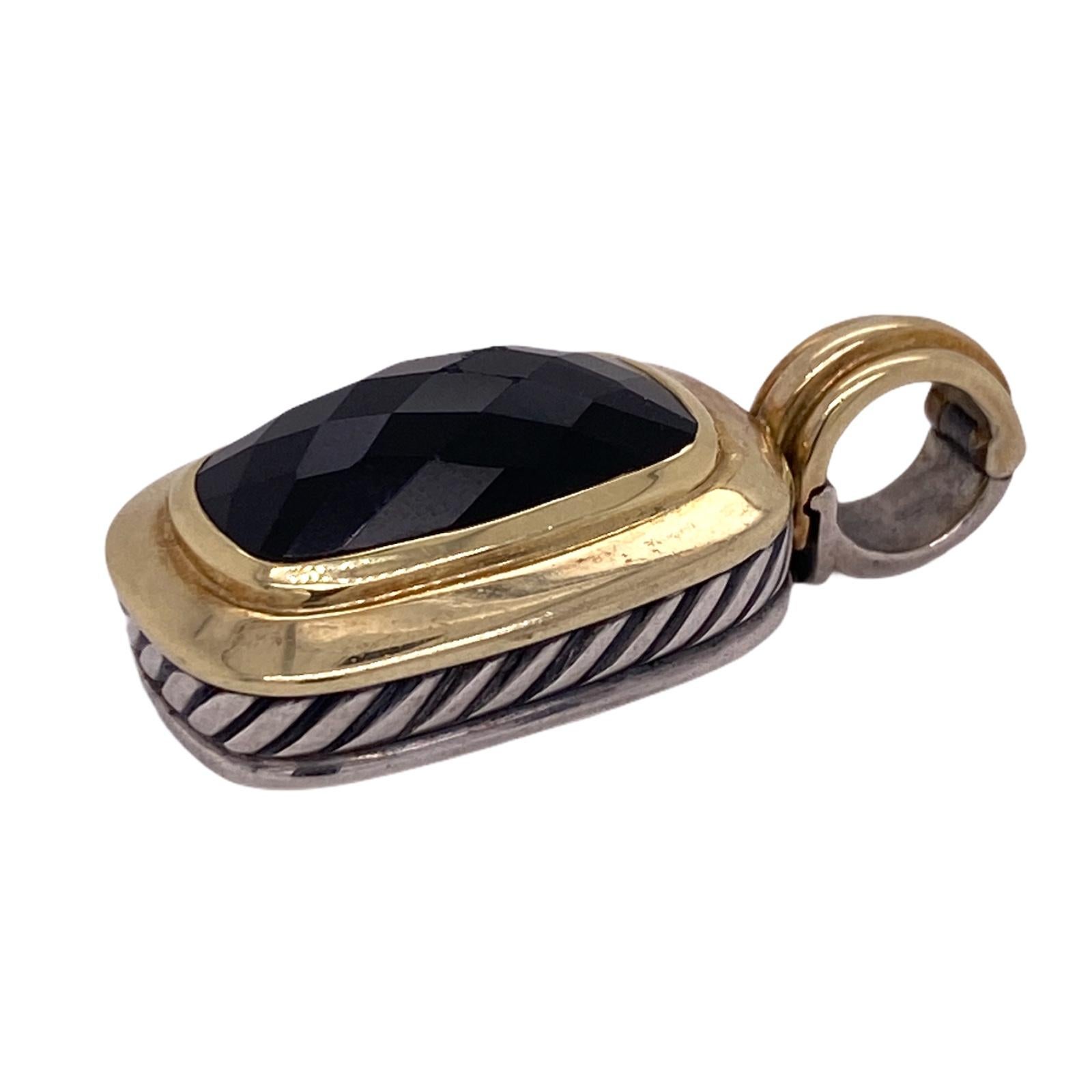 Beautiful Albion pendant by designer David Yurman fashioned in 18 karat yellow gold and sterling silver. The pendant features a rectangular faceted onyx gemstone set in an 18 karat yellow gold front. Yurman's classic cable design is seen on the