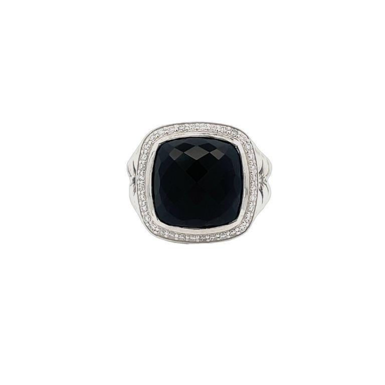 This exclusive design is renowned for its stunning centerpiece—a 7.00 CT black onyx gemstone, meticulously cut into a beautiful cushion shape. This lustrous stone is elegantly encircled by 0.70CT of brilliant white round melee diamonds, accentuating