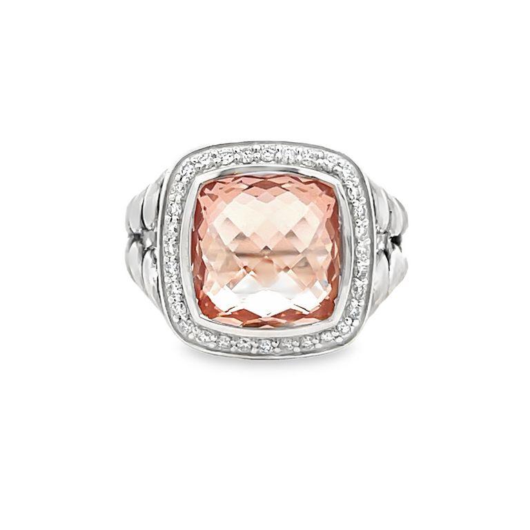 This exclusive design is renowned for its stunning centerpiece—a 7.00 CT morganite gemstone, meticulously cut into a beautiful cushion shape. This lustrous stone is elegantly encircled by 0.70CT of brilliant white round melee diamonds, accentuating