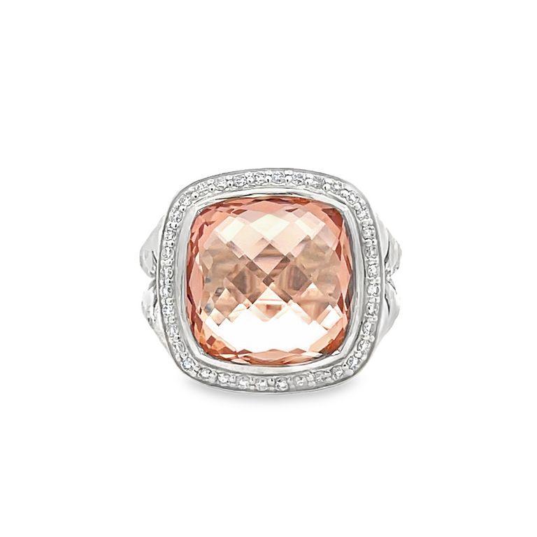 This exclusive design is renowned for its stunning centerpiece—a 7.00 CT morganite gemstone, meticulously cut into a beautiful cushion shape. This lustrous stone is elegantly encircled by 0.70CT of brilliant white round melee diamonds, accentuating