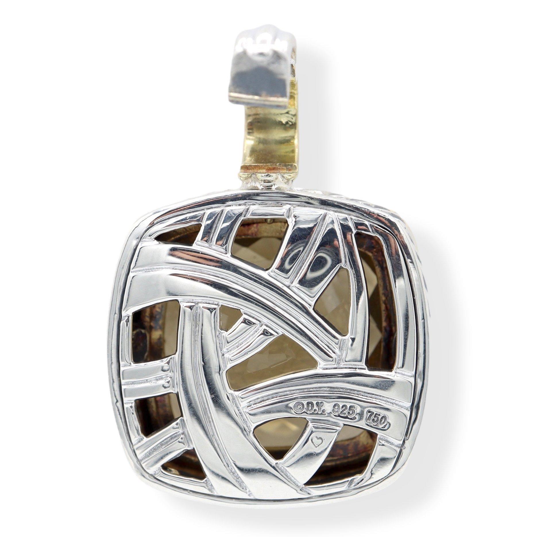 David Yurman pendant finely crafted in sterling silver featuring a 20 mm center citrine set inside an 18 karat yellow gold bezel on top of the classic cable design. Pendant has a clip bale to easily adapt to necklace. Fully hallmarked with logo and