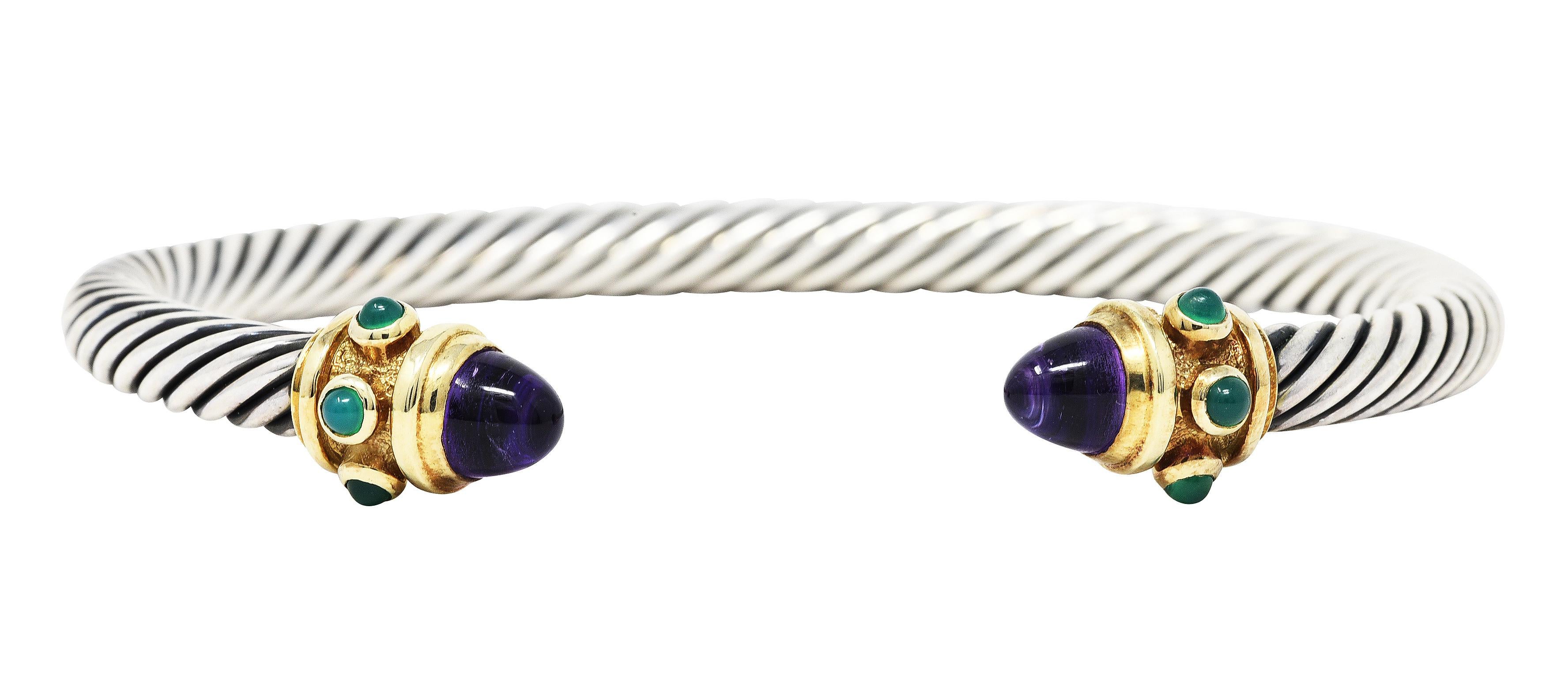 Designed as an open cuff bracelet comprised of twisting sterling silver cable 

Deeply ridged gold terminals completed by 6.0 mm amethyst bullet cabochons - transparent purple in color

Accented by bluish green bezel set 3.0 mm chrysoprase