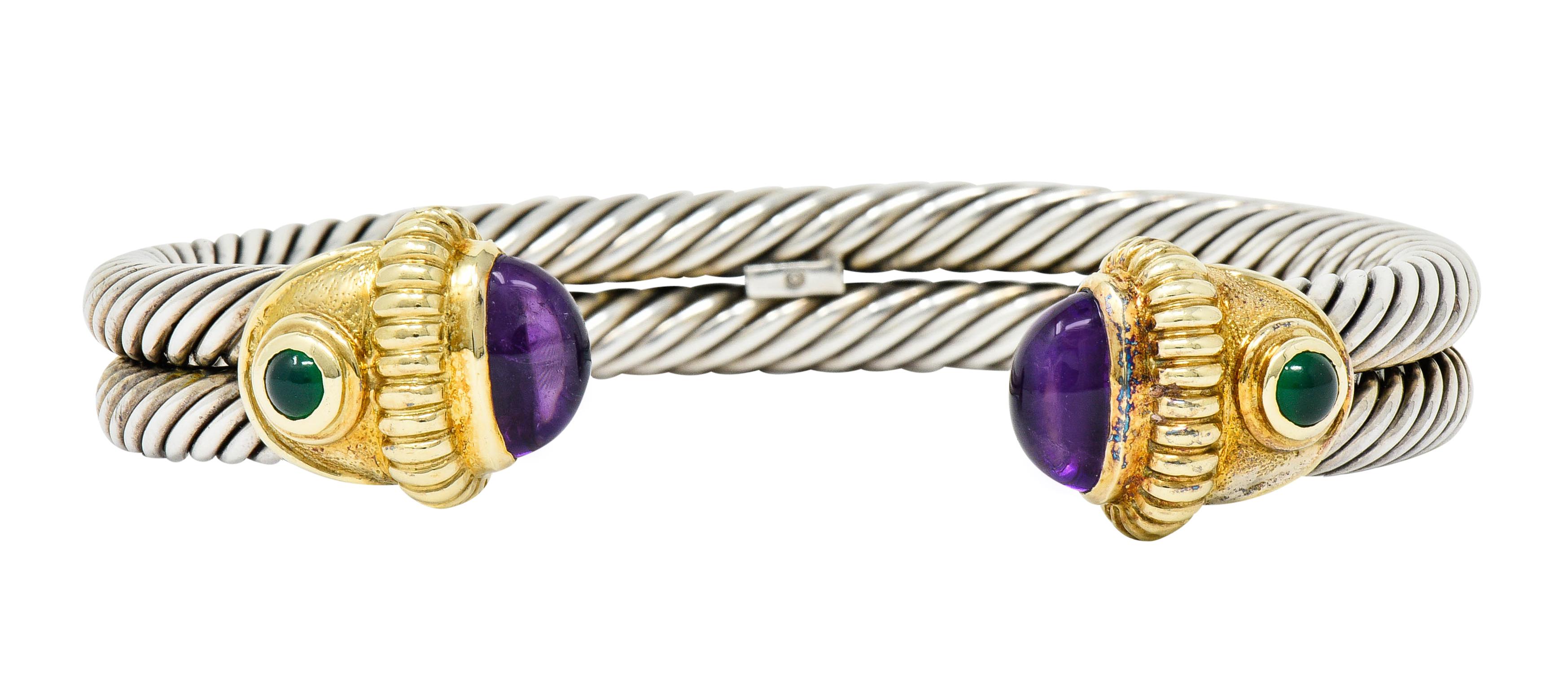 Designed as an open cuff bracelet comprised of a double row of twisted sterling silver cables

With deeply ridged gold terminals completed by amethyst cabochons; medium-dark purple in color

Accented by bright bluish-green and bezel set 3.0 mm