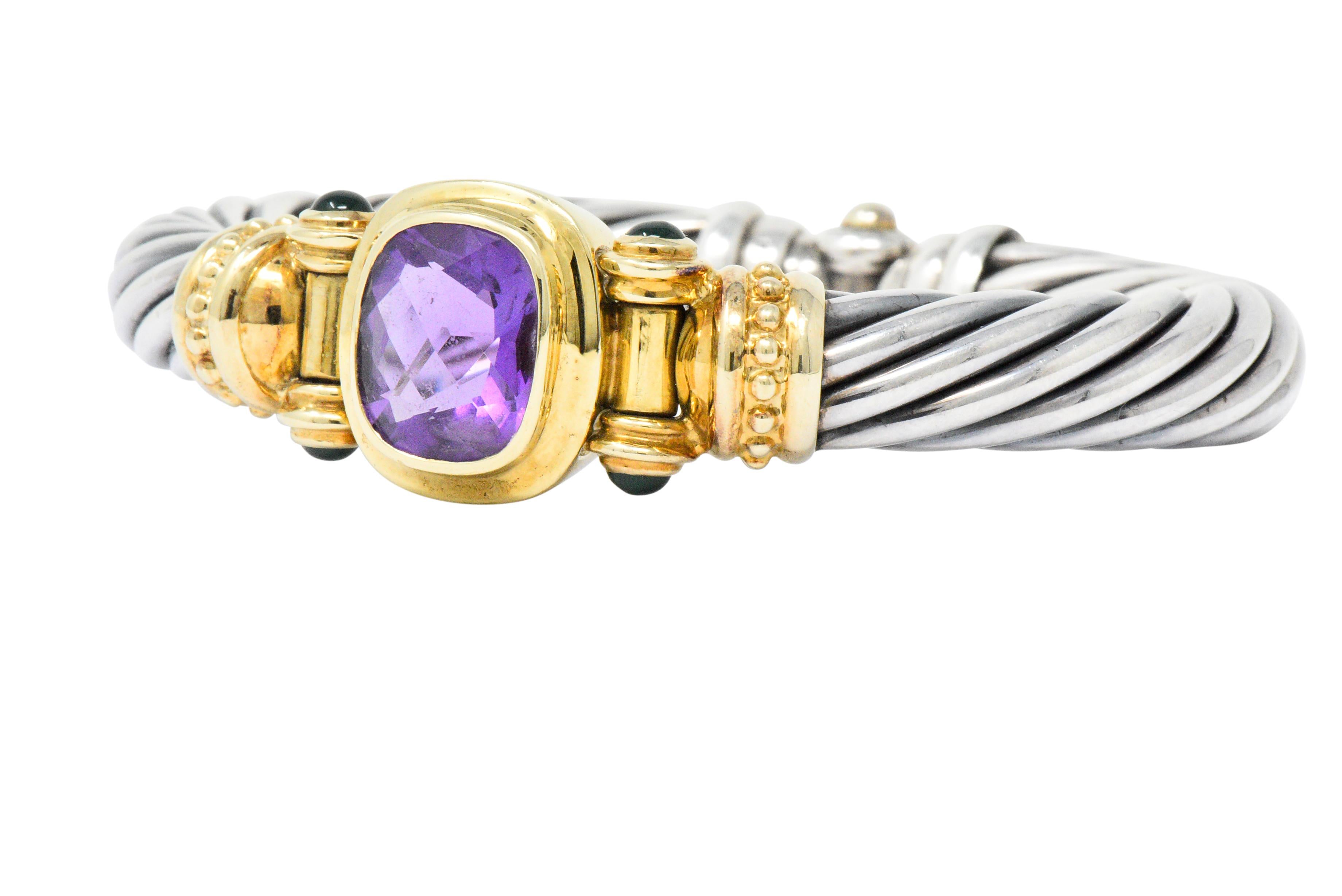 Bangle cuff style bracelet comprised of the classic twisted cable motif in silver

Centering a checkerboard cushion cut amethyst that measures approximately 15.5 x 13.5 mm; transparent and richly purple in color

Bezel set in gold and flanked by