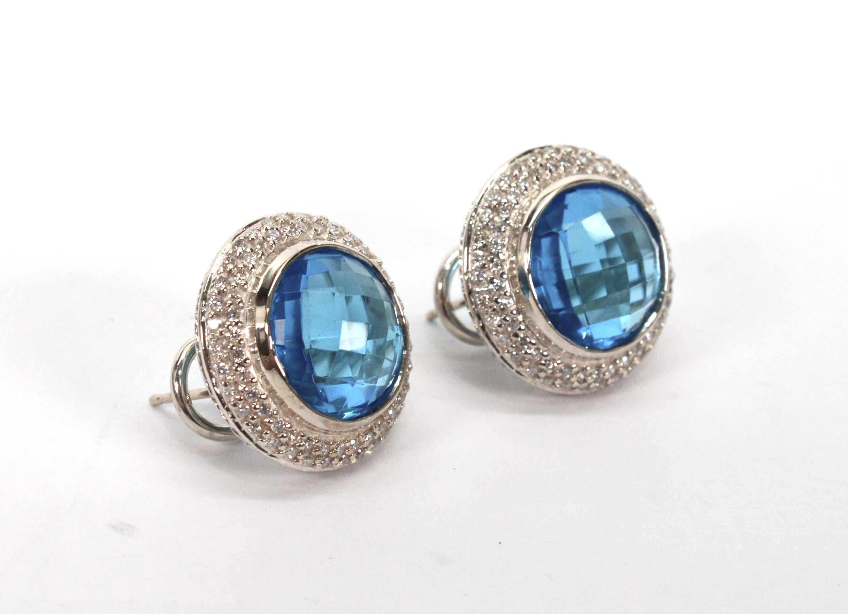 Vibrant blue topaz with a pave diamond halo create an elegant presentation set in bright sterling silver by David Yurman. 
A showstopper, the gorgeous 12mm blue topaz has a multi-faceted checkerboard fantasy cut, that is bezel set in sterling. Each