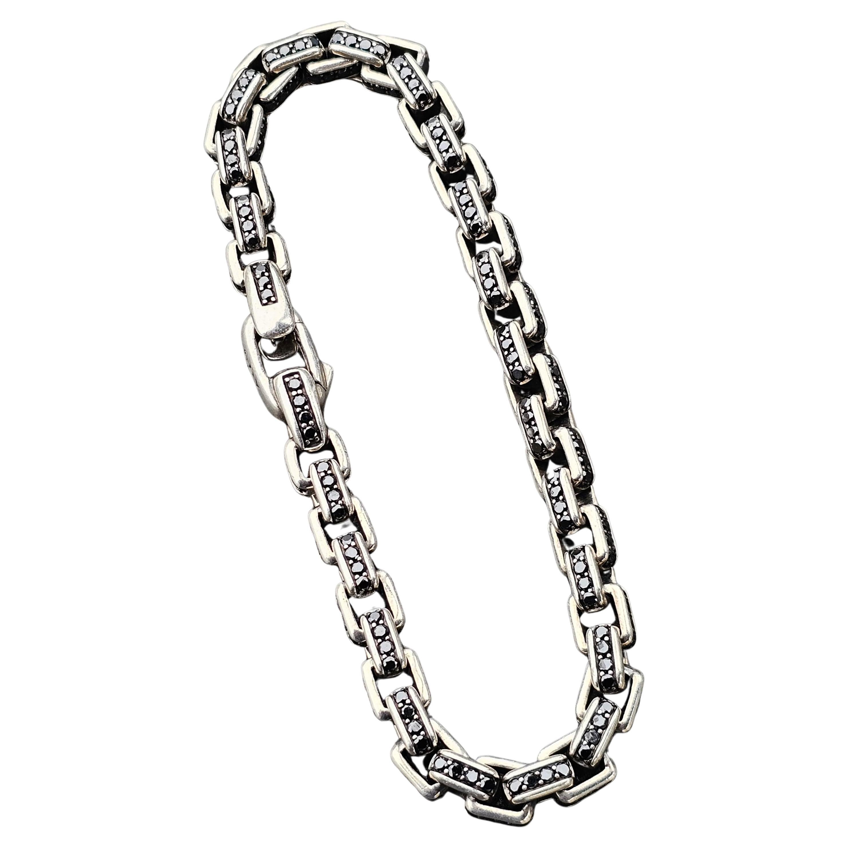 Enhance your collection with this David Yurman Chain Bracelet. Crafted from sterling silver, this piece features a bold design with black diamonds totaling 8.92 carats. Measuring 9.25 inches in length, it offers a substantial presence on the wrist. 