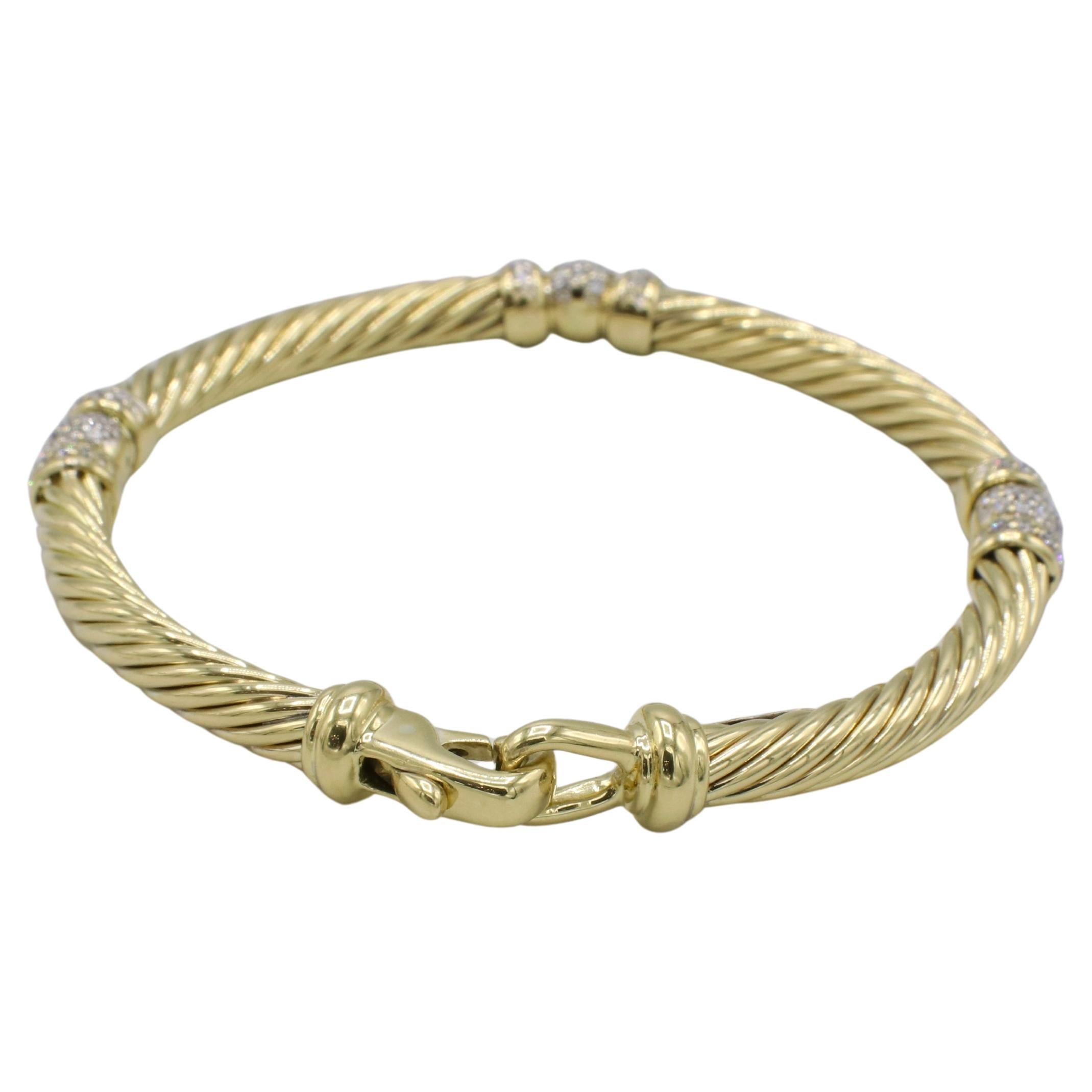 David Yurman Cable 18 Karat Yellow Gold Natural Diamond Station Bracelet 
Metal: 18k yellow gold
Weight: 24.8 grams
Size: Fits up to a 7 inch wrist clasped
Width: 5mm
Diamonds: Approx. 1.00 CTW G-H VS natural round diamonds
Signed: ©D.Y. 750
RLDD