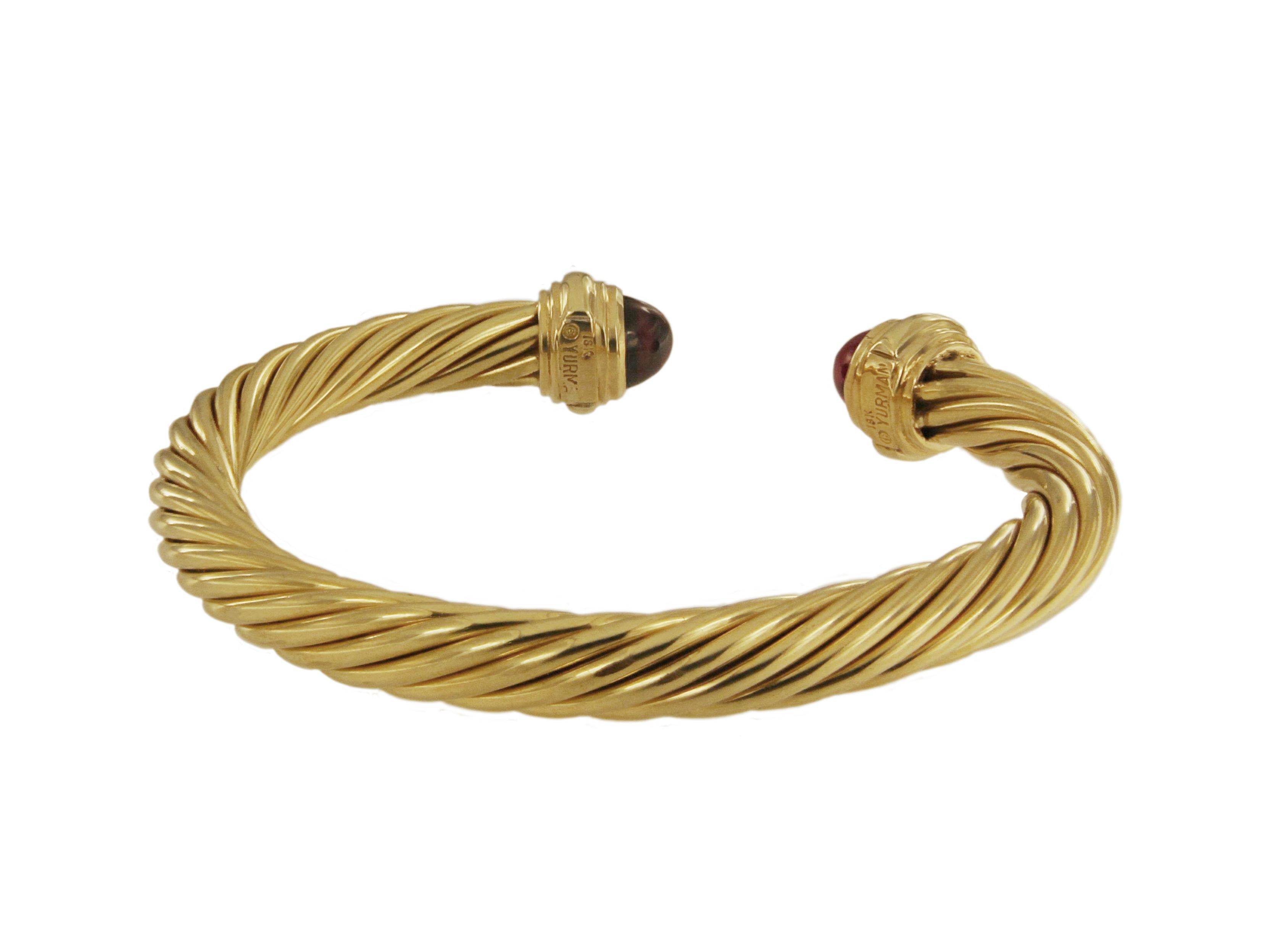 -Mint condition

-18k Yellow Gold

-Garnet faceted

-Cable, 7mm wide

-Weight: 26gr

-Size: Medium

-David Yurman box included.