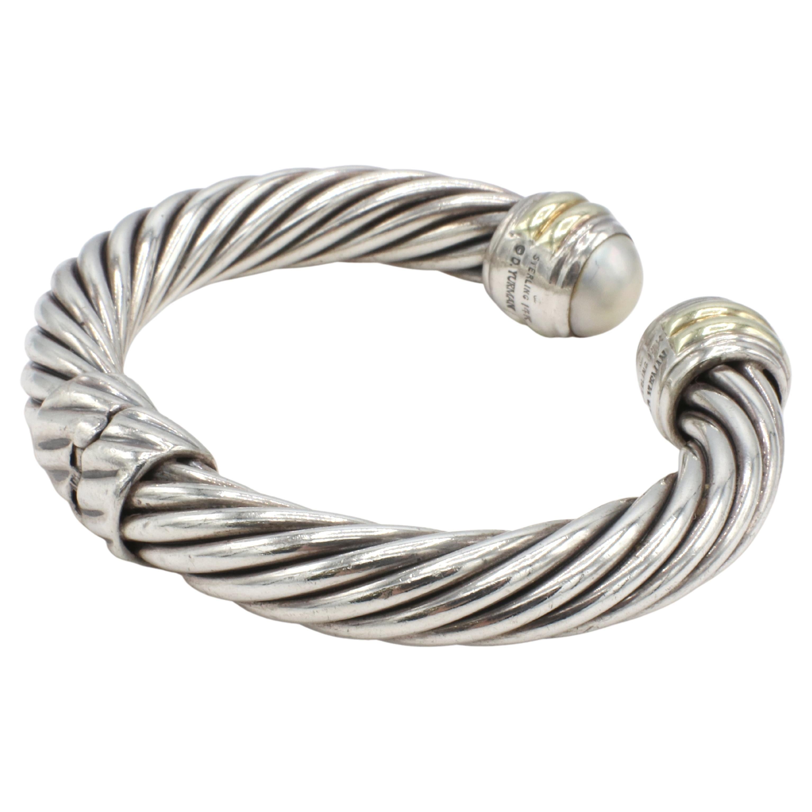 David Yurman Cable Classic Mabe Pearl Hinged Cuff Bracelet 
Metal: Sterling silver & 14k yellow gold
Weight: 45.18 grams
Width: 10mm
Circumference: Approx. 6.25 inches
Inside Diameter: 55mm
Note: Slight surface scratches and small dents 