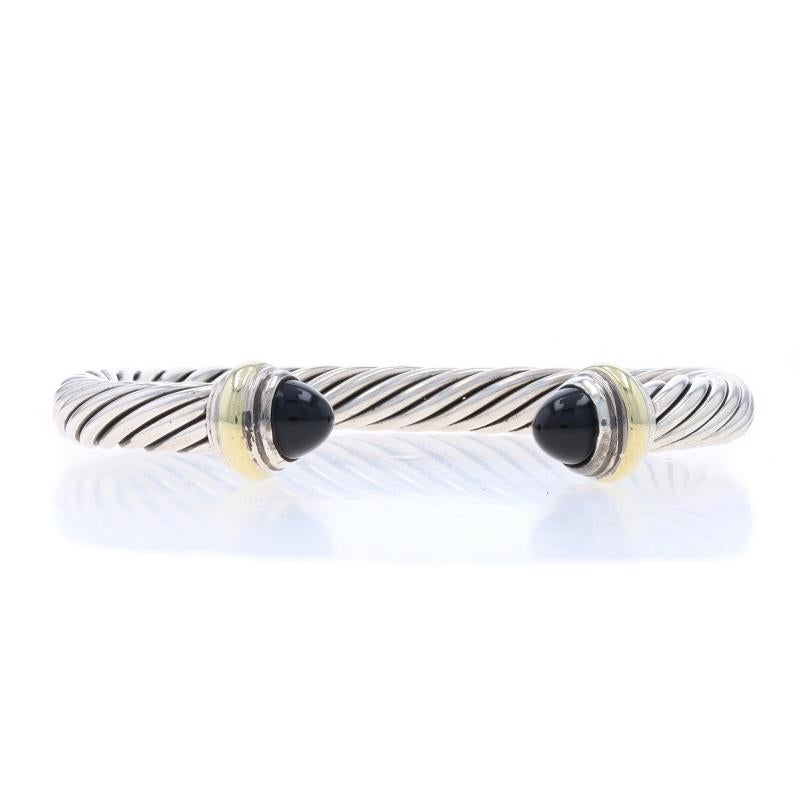 Brand: David Yurman
Collection: Cable Classics
Design:  7mm

Metal Content: Sterling Silver & 14k Yellow Gold

Stone Information

Natural Onyx
Cut: Round Cabochon
Color: Black

Style: Cuff
Fastening Type: N/A (slides over wrist)

Measurements

Inner