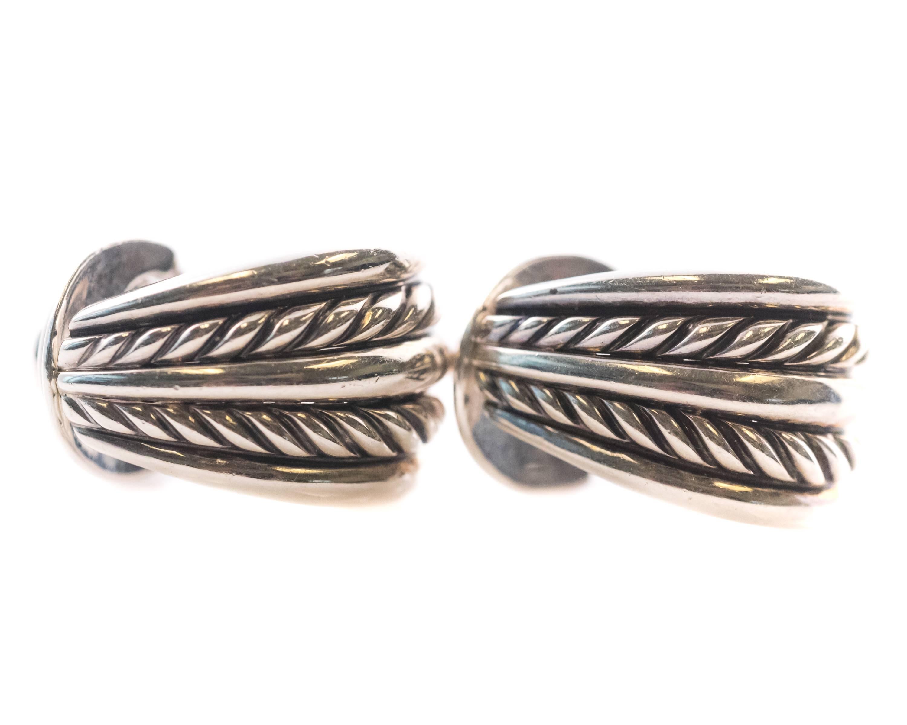 David Yurman Cable Collectibles Sterling Silver Hoop Earrings.

Feature Sterling Silver and double omega hinge backs. 
These everyday classic earrings measure 1.25 inches long x .78 inches wide. They are Hallmarked DY. 

Item Details: 
Measurements: