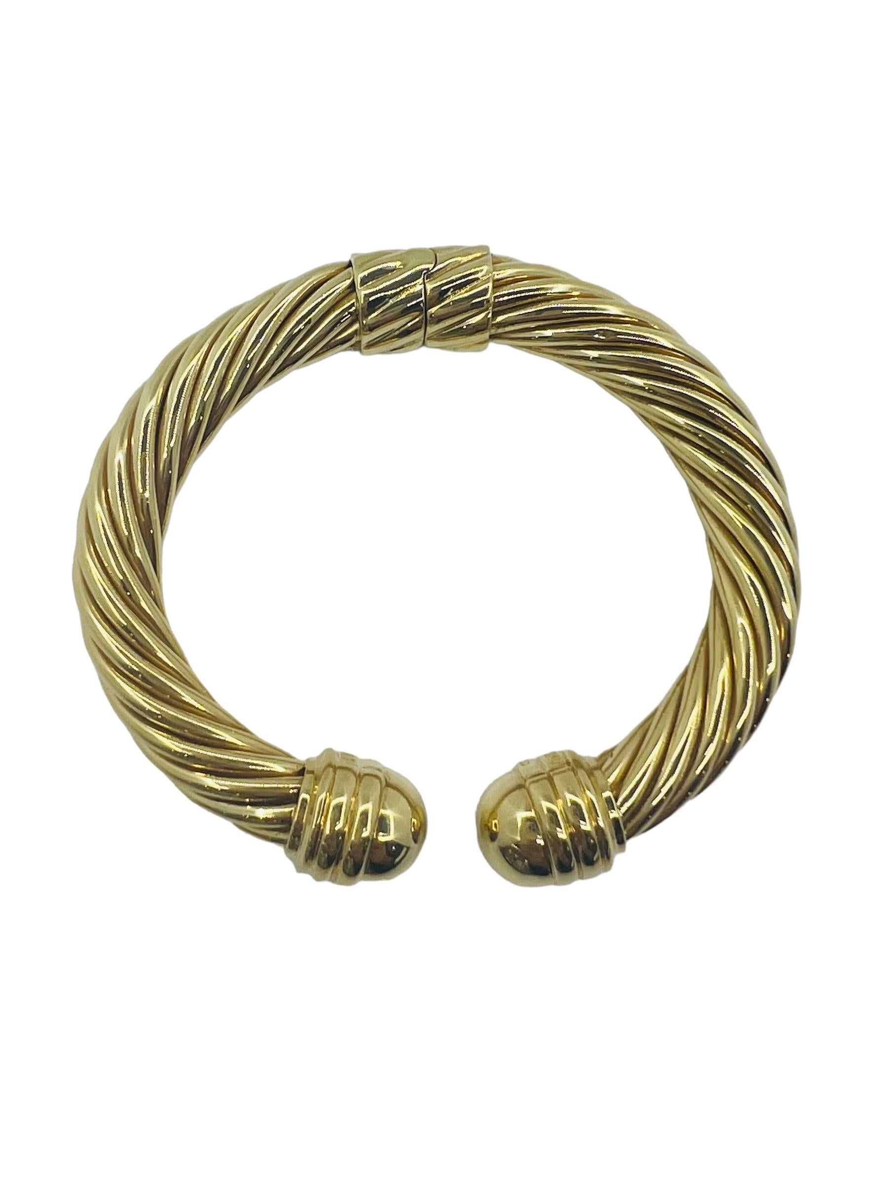 Like New in Excellent Condition. David Yurman cable collection. 18k Yellow Gold. Size Medium. 6.5 inches 9mm Wide. Comes with Box. Retail is $8500