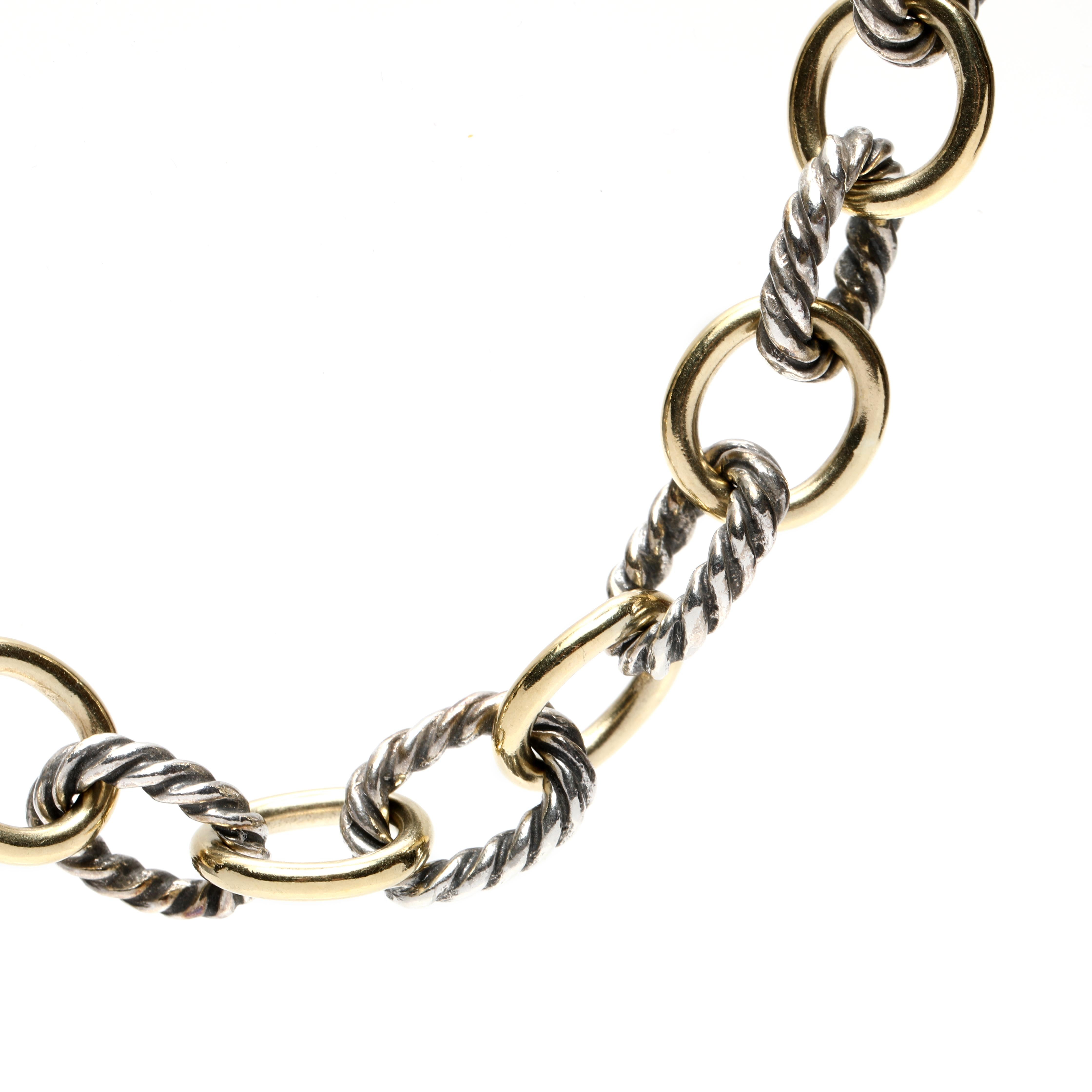 This exquisite David Yurman Cable Classics Medium Oval Link Chain is crafted in 18K yellow gold and sterling silver. This two-tone oval link chain features a unique blend of elegance and sophistication, perfect for any occasion. The 16-inch Cable