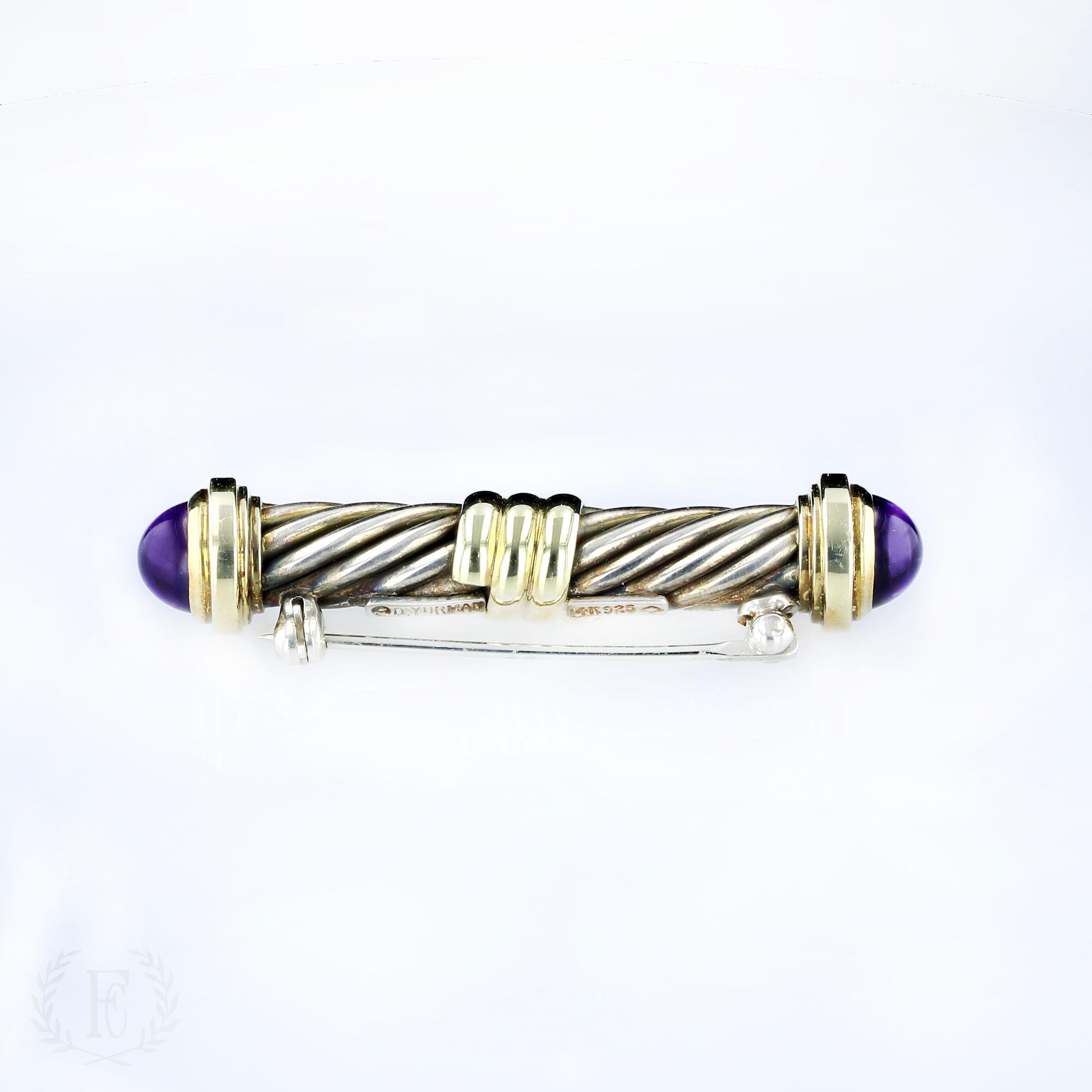 This estate sterling silver David Yurman pin features 14k yellow gold accents and a pair of amethyst cabochons that elegantly adorn the classic cable twist design. 

A great gentleman's gift; can be worn as a tie pin. 