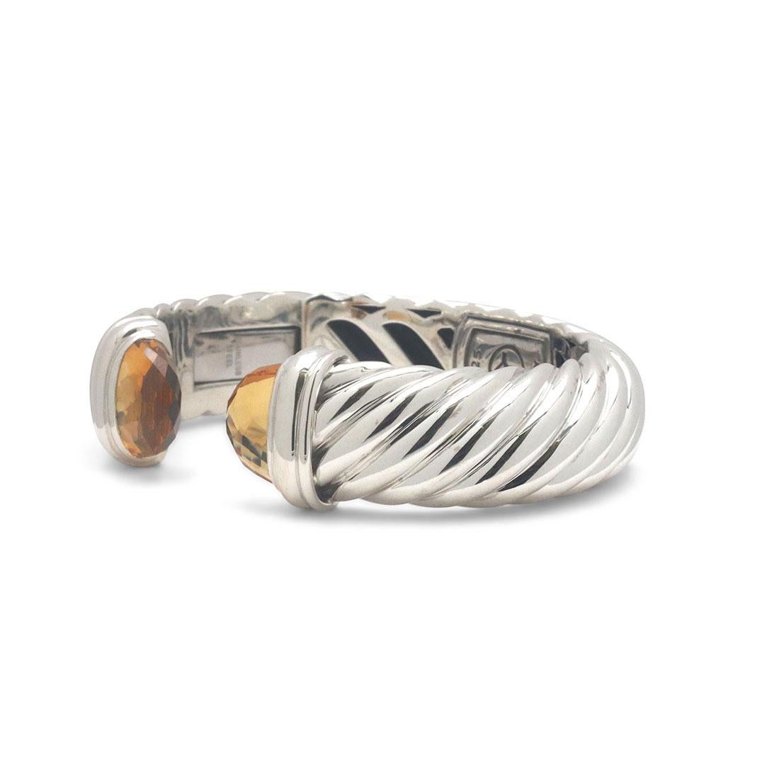 Authentic David Yurman Cable silver bangle bracelet, crafted in sterling silver. Featuring two faceted citrine stones on each end of the split bracelet. Fits up to a 51/2 inch wrist. Signed D.Y., 925. CIRCA 2000s

Brand: David Yurman
Collection: