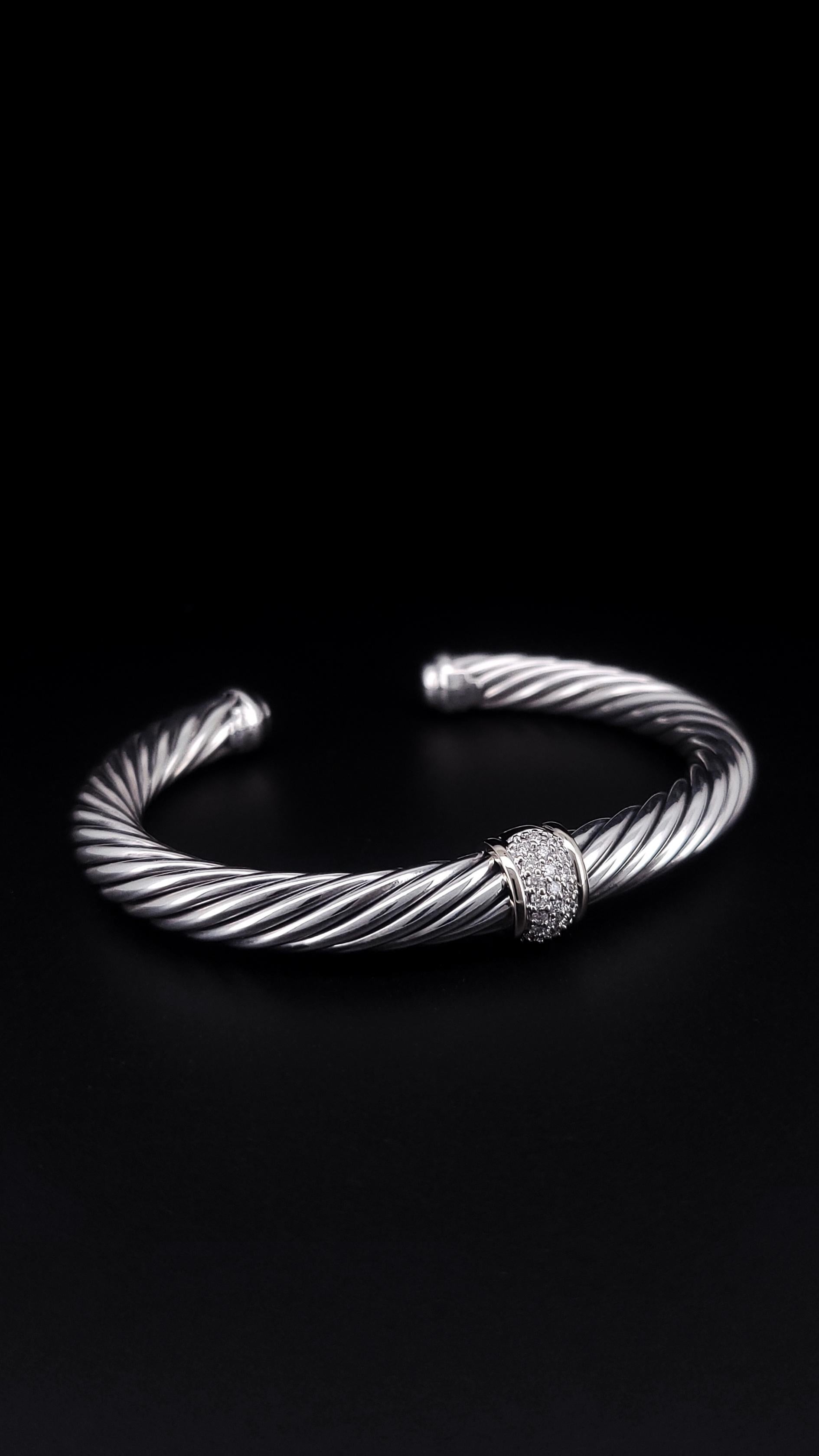 David Yurman’s artistic signature, Cable began as a bracelet that he hand-twisted from 50 feet of wire. For the past 30 years, he has evolved the twisted helix into a myriad of designs.

Sterling silver with 18-karat white gold
Pavé-set diamonds,