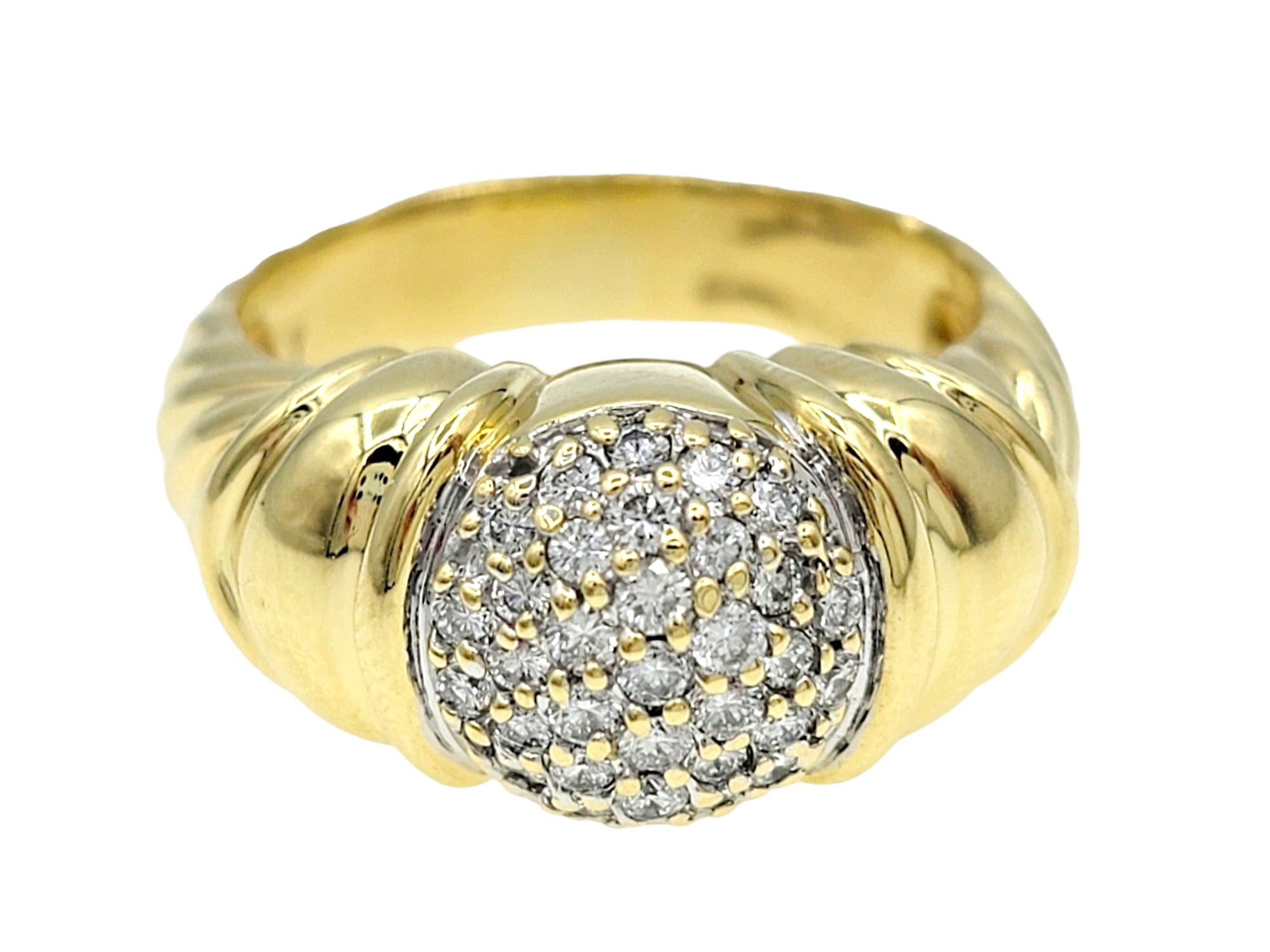 Ring Size: 7

The David Yurman Capri Cable ring in 18 karat yellow gold is a stunning piece that combines classic elegance with distinctive design elements. The center of the ring features a circle adorned with pave diamonds, adding a touch of