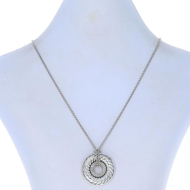 Retail Price: $1550

Brand: David Yurman
Collection: Carved Cable
Design: Circle Donut

Metal Content: Sterling Silver

Stone Information
Natural Diamonds
Carat(s): .38ctw
Cut: Round Brilliant

Total Carats: .38ctw

Chain Style: Box
Necklace Style: