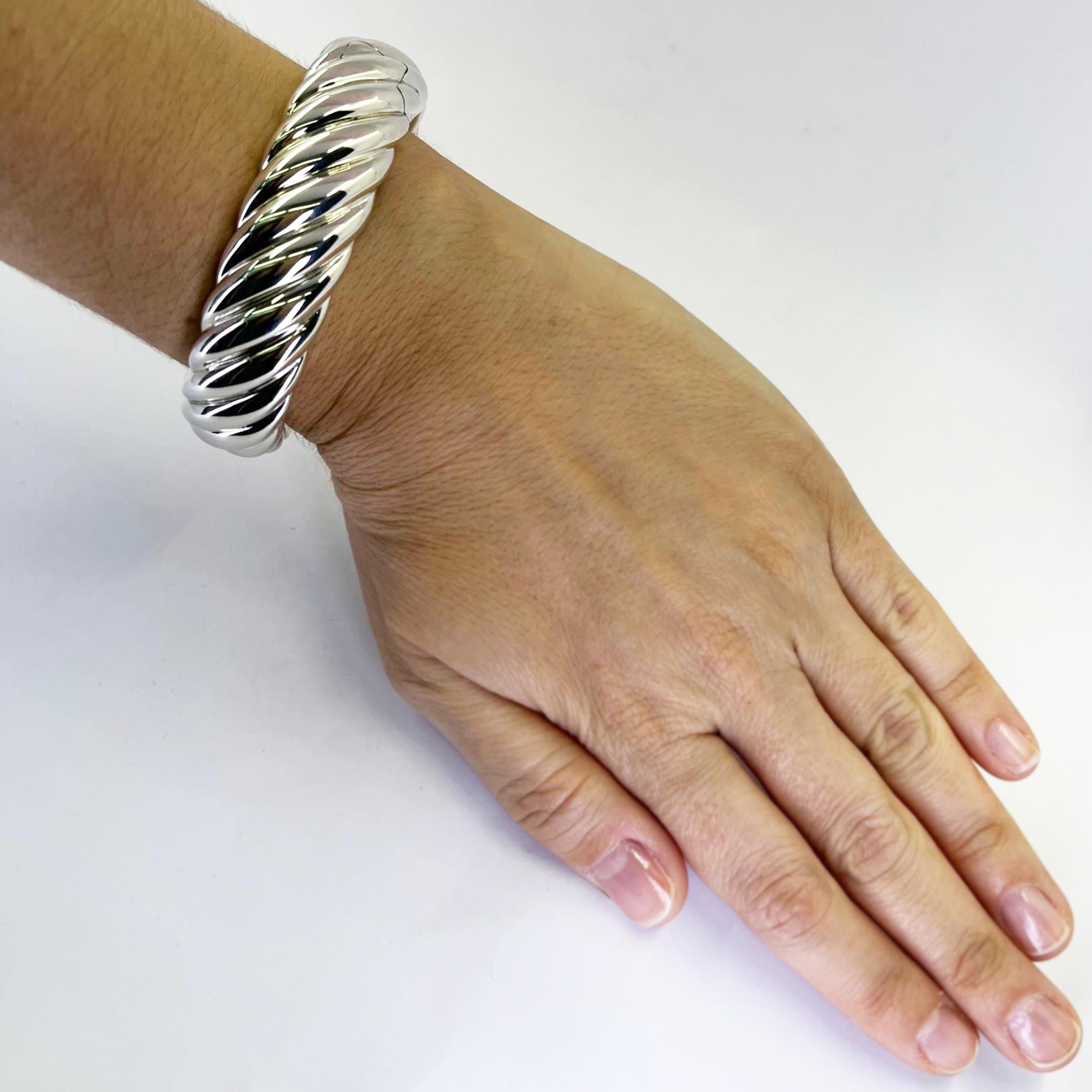 David Yurman 18mm wide sterling silver cable cuff bracelet featuring steel hinged closure. $900 MSRP. Includes David Yurman travel pouch.
