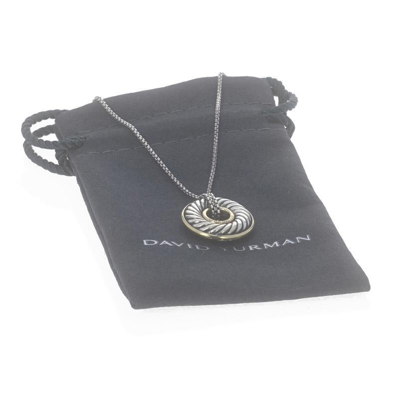 Brand: David Yurman
Collection: Carved Cable
Design:  Disc Charm

Metal Content: Sterling Silver & 18k Yellow Gold

Chain Style: Box
Necklace Style: Chain
Fastening Type: Lobster Claw Clasp
Theme: Circle

Measurements

Item 1: Attached Pendant
Tall: