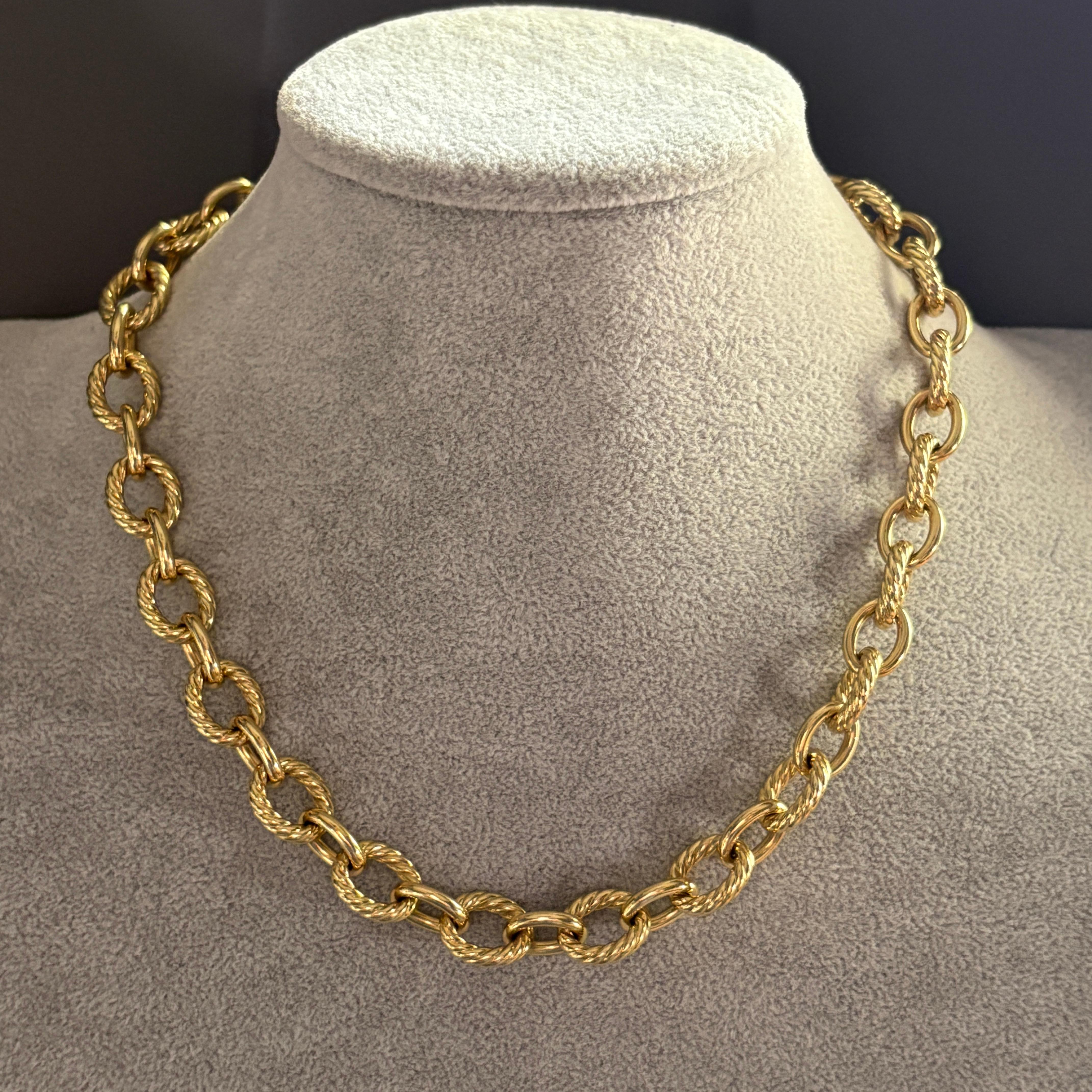 An iconic statement piece from David Yurman, this oval link chain necklace is crafted in solid 18K yellow gold with bold 16mm links. Substantial and luxurious, the necklace measures 18 inches in length, though due to the thickness of the links it
