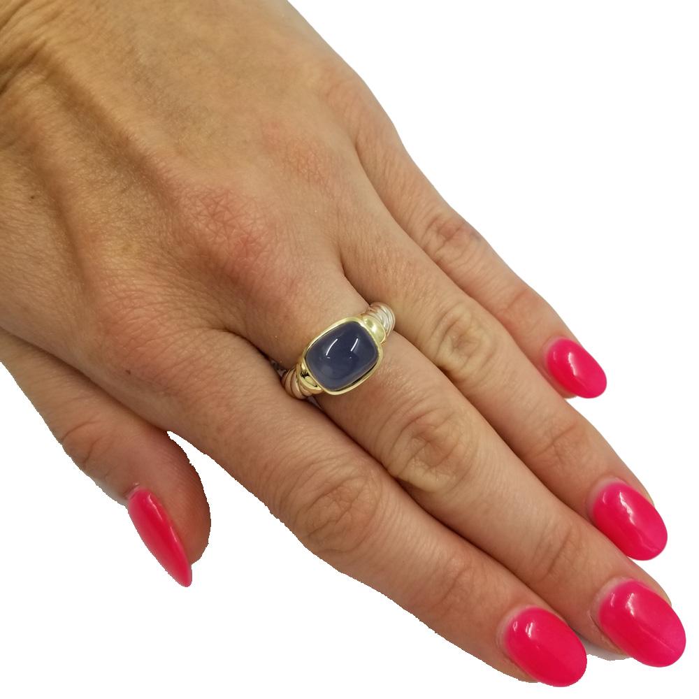 Sterling silver & 14 karat yellow gold ring from David Yurman Noblesse collection. The ring features a bezel set cushion cut cabochon chalcedony quartz center stone. The band is a slightly tapered design with cable accents.  Current finger size 6;