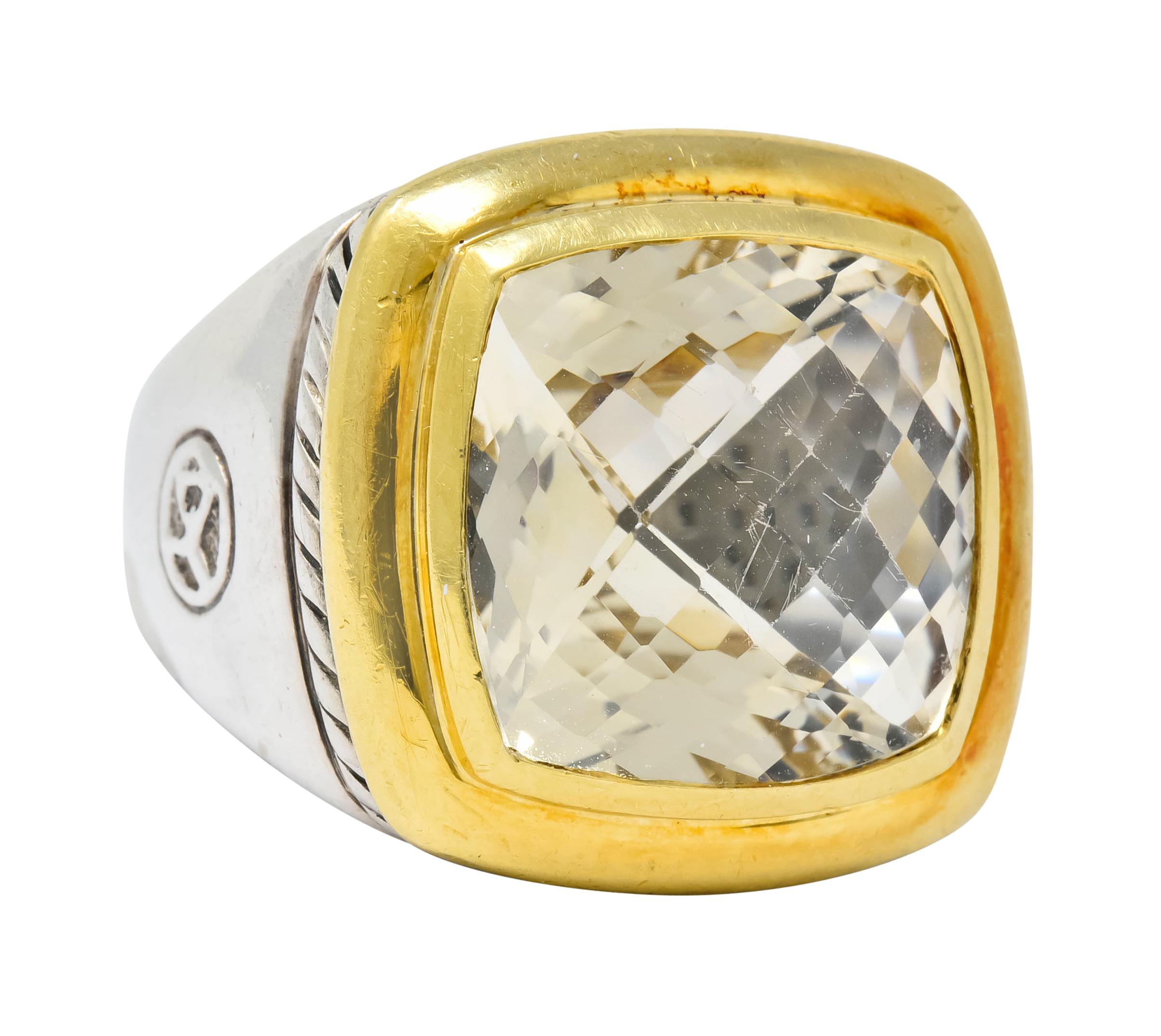 Centering a cushion cut checkerboard colorless quartz measuring approximately 14.0 x 14.0 mm

Bezel set in a polished gold surround offset by twisted cable motif deeply engraved into silver mounting

One shoulder features a highly rendered maker's