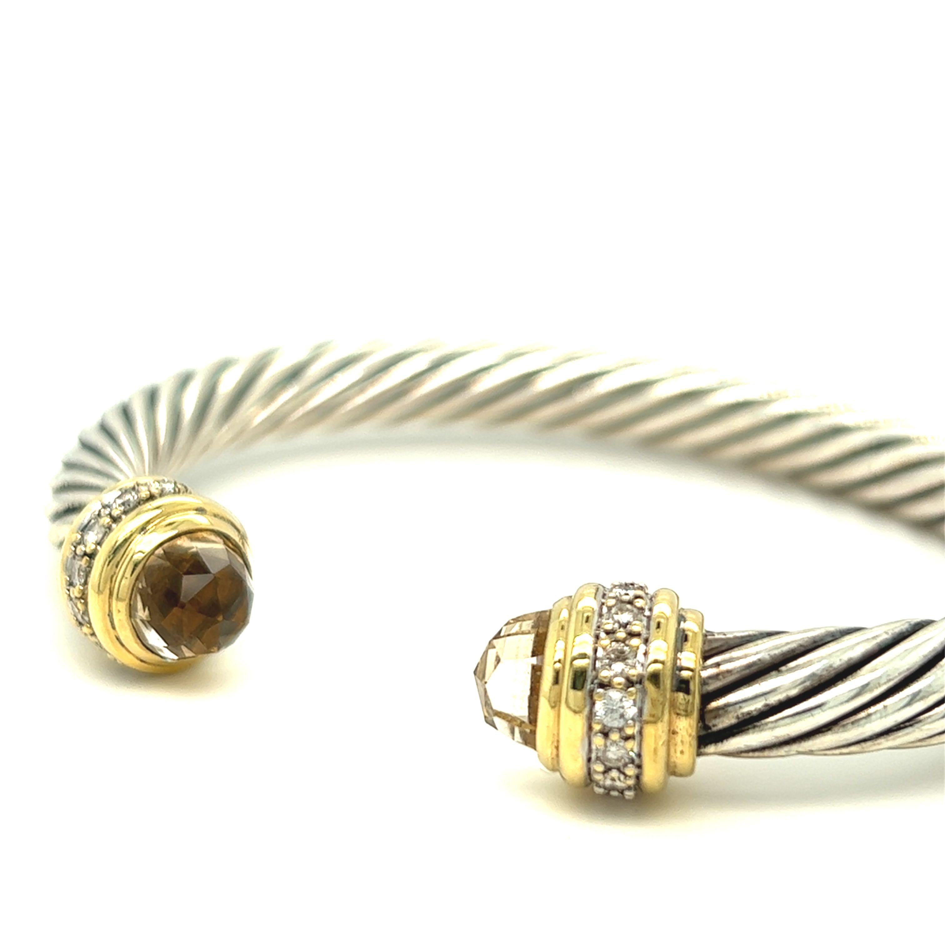 From The Cable Collection for Women by David Yurman, this cable cuff bracelet in sterling silver and 18k yellow gold is decorated with citrine and pavé diamonds. 
Stamp D.Y 925 750

Designer: David Yurman
Material: sterling silver & 18K yellow