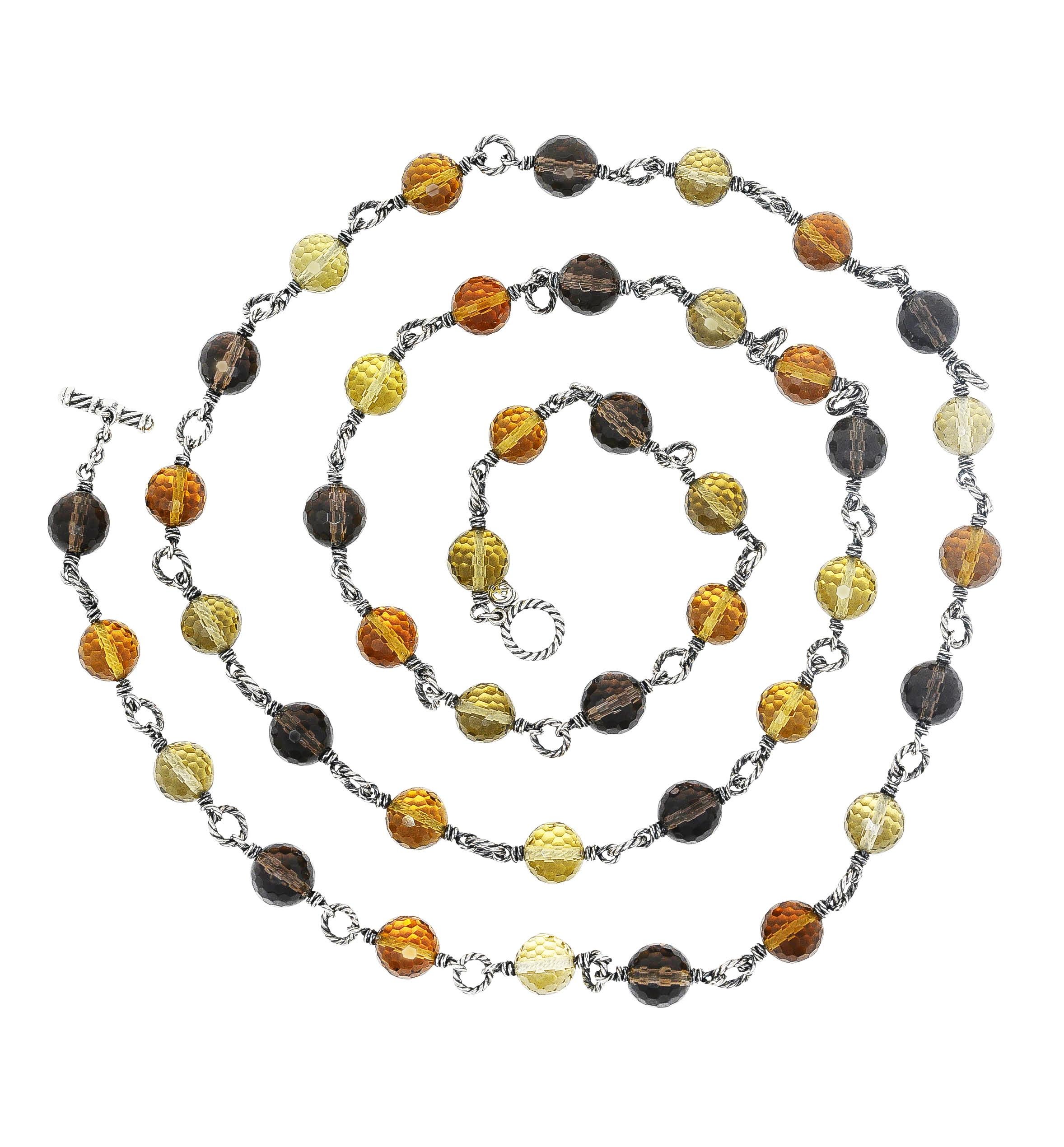 Necklace designed as alternating 10.0 mm round faceted bead stations

Bead stations consist of citrine, smoky quartz, and rock crystal quartz

Ombrè color with light yellow, light orange, and saturated brown color

Stations are separated by 7.0 mm
