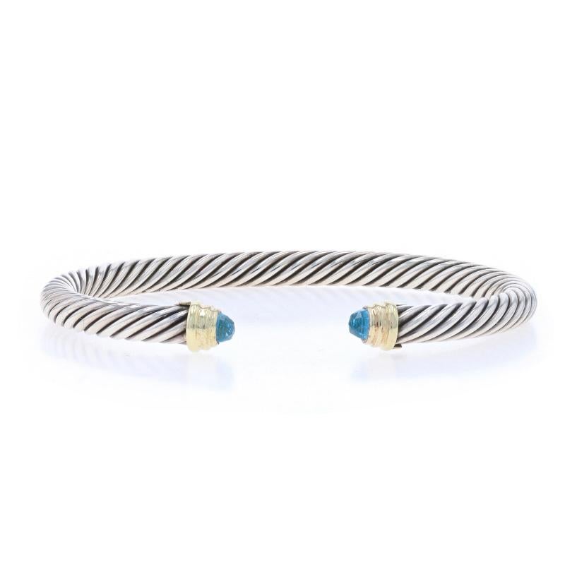 Retail Price: $595

Brand: David Yurman
Collection: Classic Cable
Design:  5mm

Metal Content: Sterling Silver & 14k Yellow Gold

Stone Information

Natural Blue Topaz
Treatment: Routinely Enhanced

Style: Cuff
Fastening Type: N/A (slides over