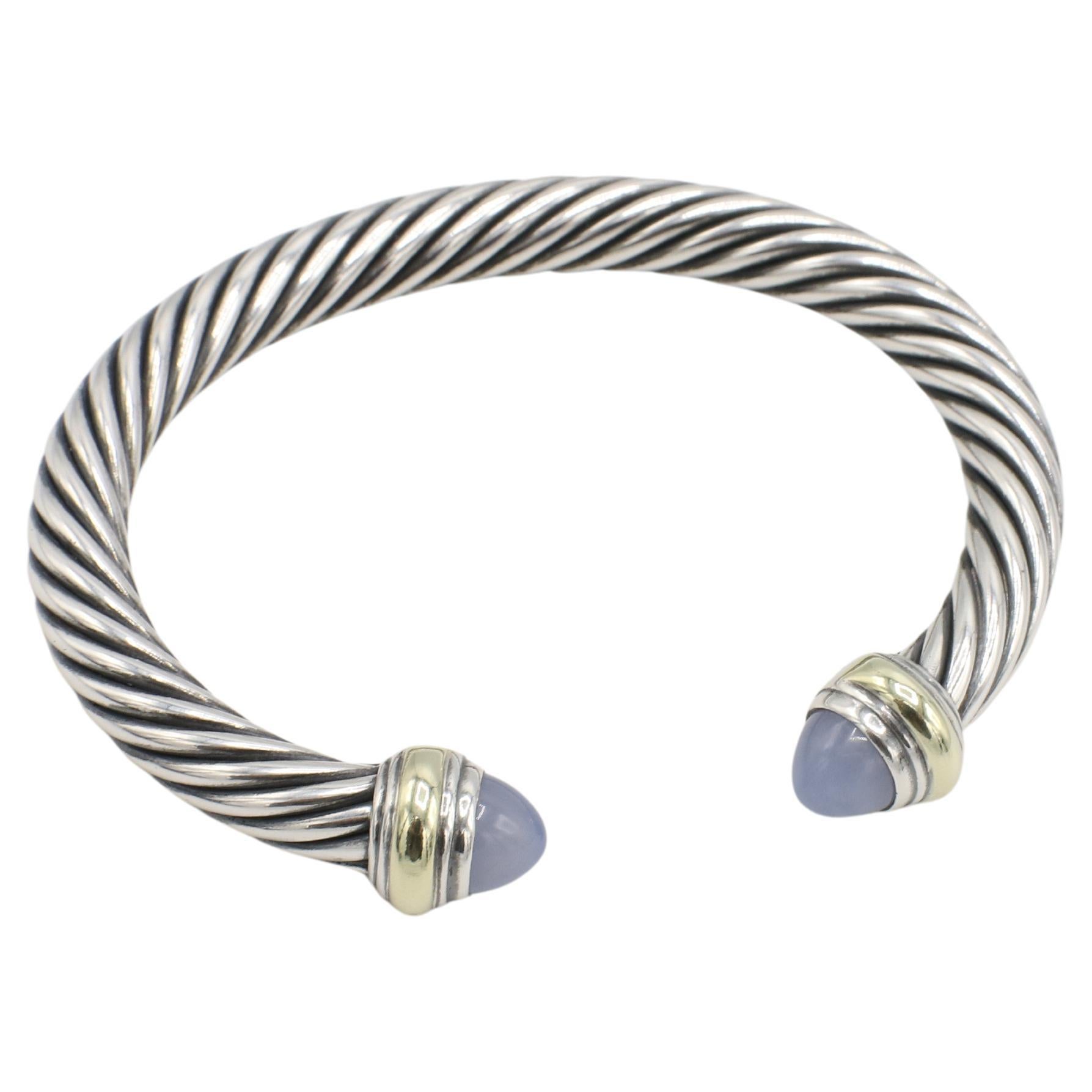 David Yurman Classic Cable Sterling Silver & Gold Chalcedony Cuff Bangle Bracelet
Metal: Sterling silver & 14k yellow gold
Weight: 41.23 grams
Width: 7mm
Size: Fits up to a 6.5 inch wrist
Signed: ©D. YURMAN 925 585
