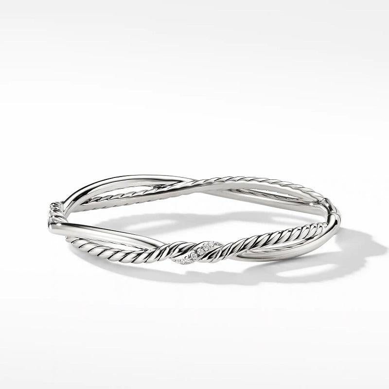 Sterling Silver
Pavé Diamonds, 0.09 total carat weight
Bracelet, 7mm
Twisted DY signature Cable and smooth wire
Push clasp
Size Medium
B13897DSSADI