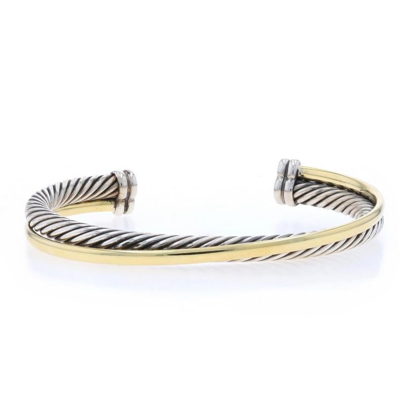 Brand: David Yurman
Design:  Crossover Cable

Metal Content: Sterling Silver & 18k Yellow Gold

Style: Cuff
Fastening Type: N/A (slides over wrist)

Measurements

Inner circumference (including the opening): 6 3/4