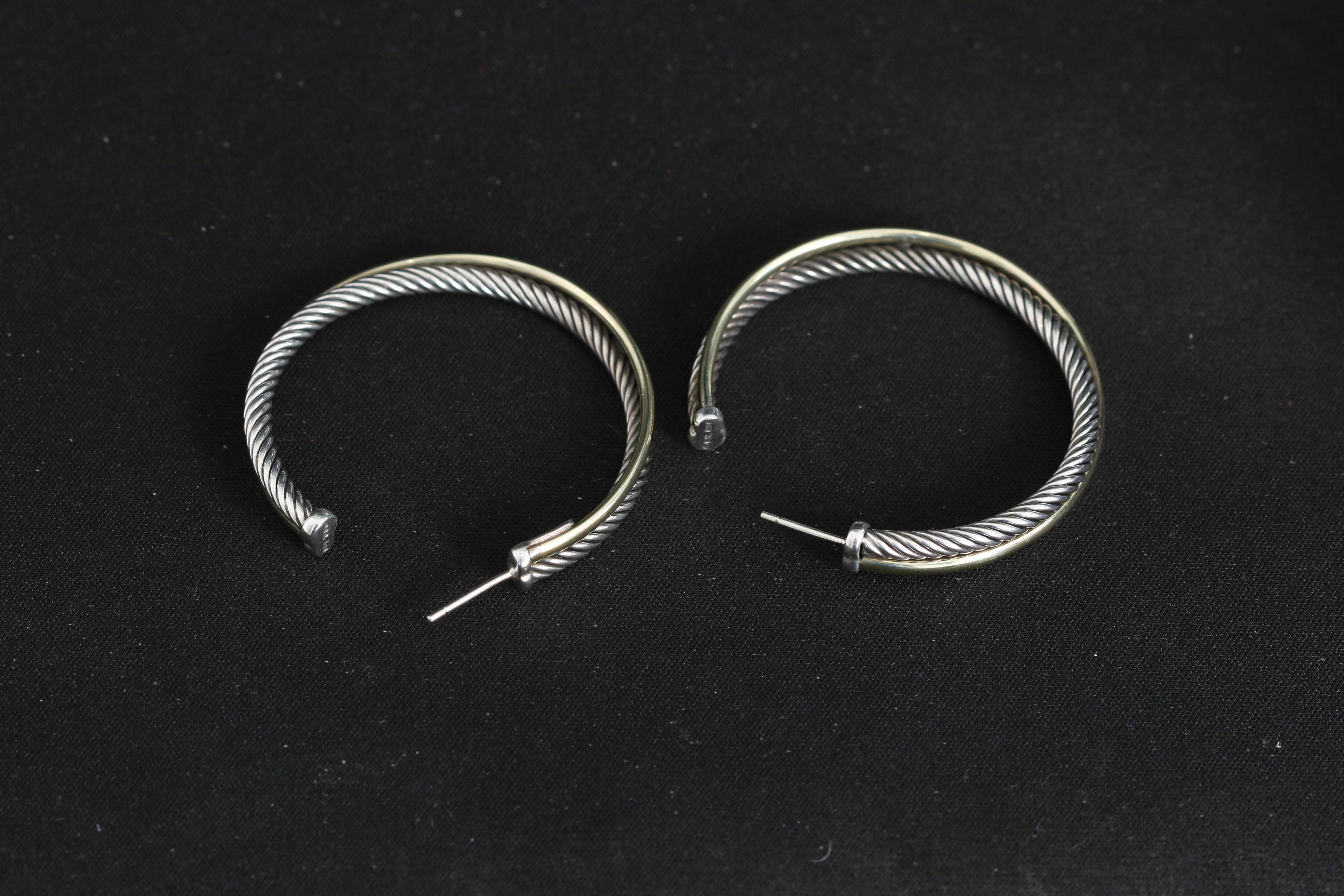 David Yurman Crossover Cable Hoop  Earrings  - Crossover cable hoops earring sin sterling silver and 18K Yellow gold .Earring measurements  44 x 4.5mm. Hallmarked with David Yurman pouch .