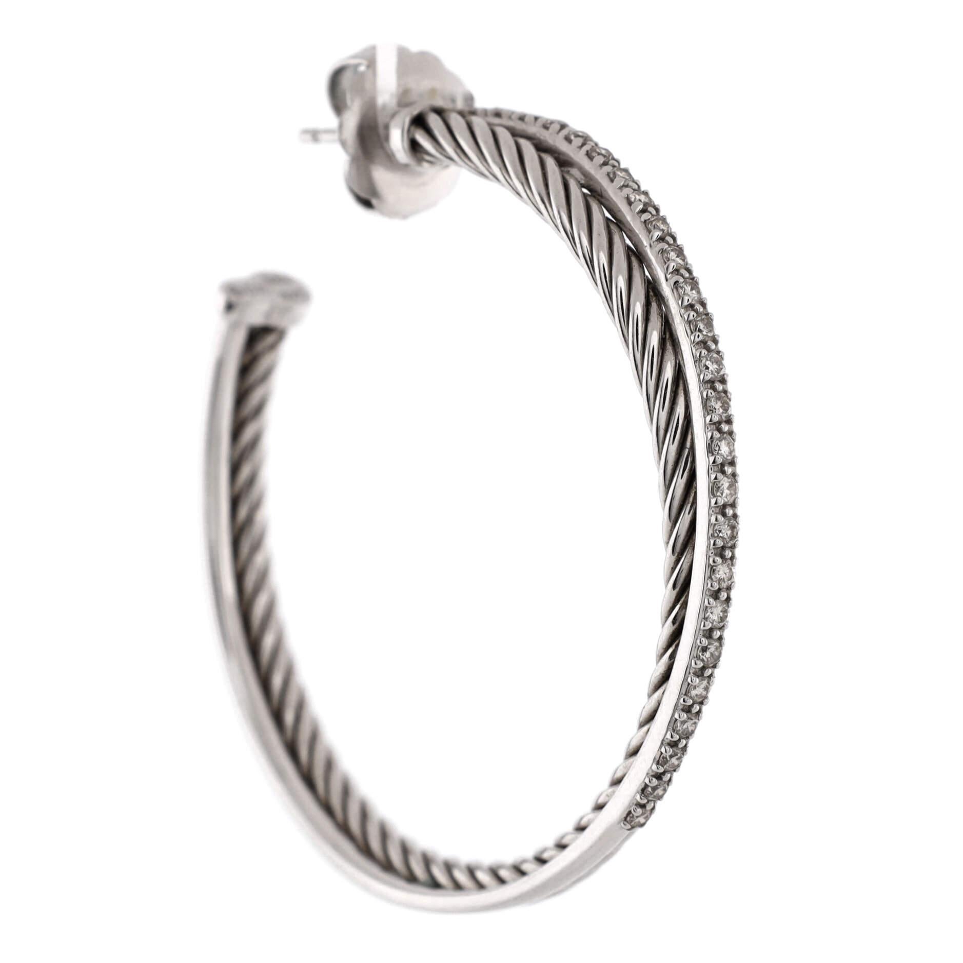Condition: Very good. Moderate wear throughout.
Accessories: No Accessories
Measurements: Height/Length: 44.00 mm, Width: 4.00 mm
Designer: David Yurman
Model: Crossover Hoop Earrings Sterling Silver and Diamonds 44mm
Exterior Color: Silver
Item