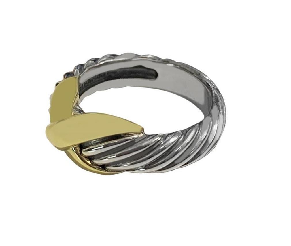 

    Ring size: 5.5
    Sterling silver with 14-karat yellow gold
    Ring, 8mm
    David  Yurman  pouch included

