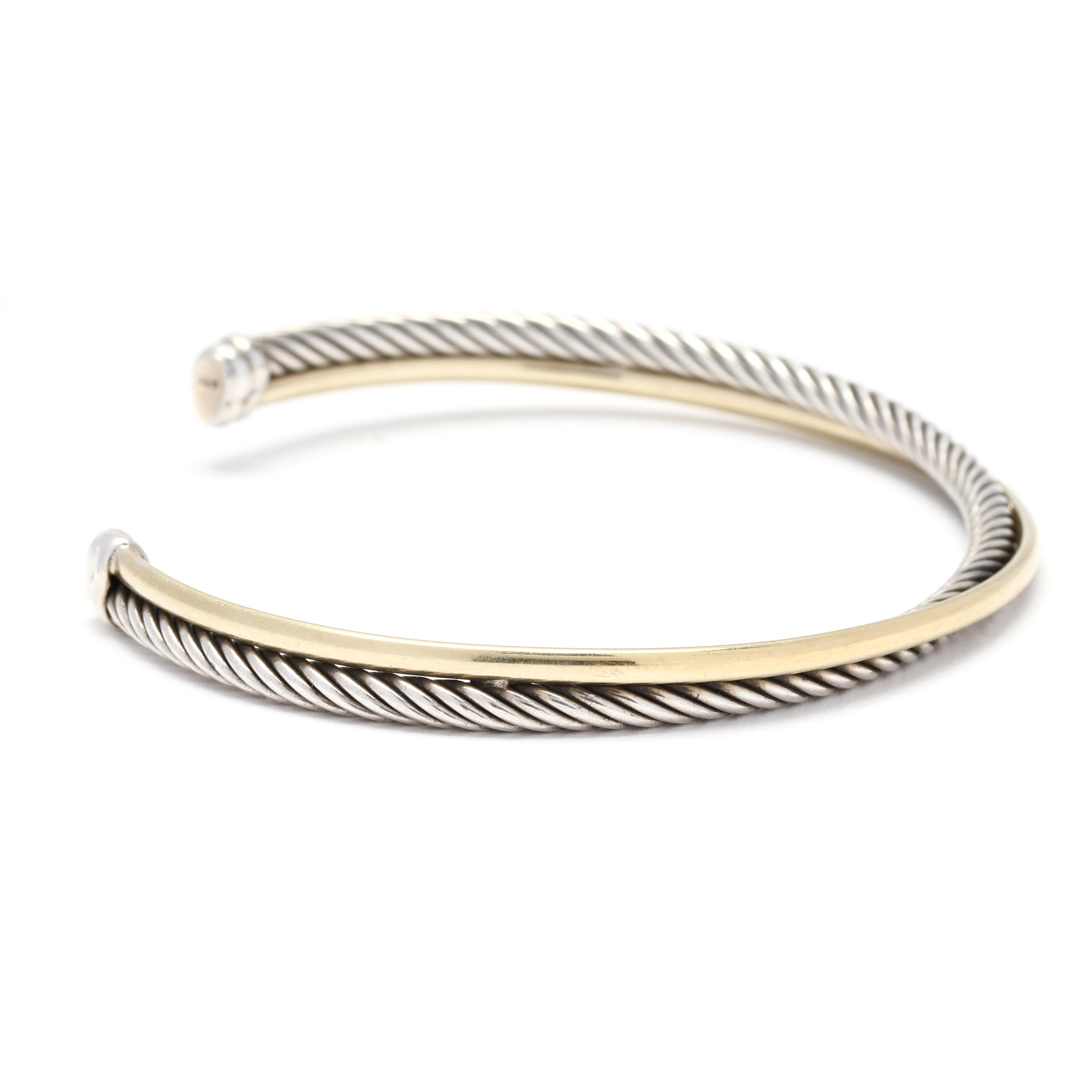 The David Yurman Crossover Cuff Bracelet is a stunning piece of jewelry that combines the warmth of 18K yellow gold with the sleekness of sterling silver. This bracelet features a crossover design, with one side crafted from 18K yellow gold and the