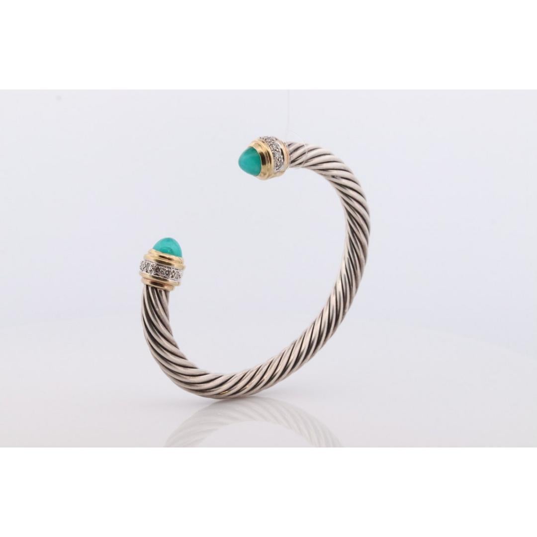 Vintage
Materials: Silver

Authentic David Yurman Cable Cuff Bracelet. Made with 18k yellow gold and Sterling Silver.

Chalcedony Acorn design with Pave Diamonds on tips.

Condition: Comes in original DY pouch. Shows little to no signs of
