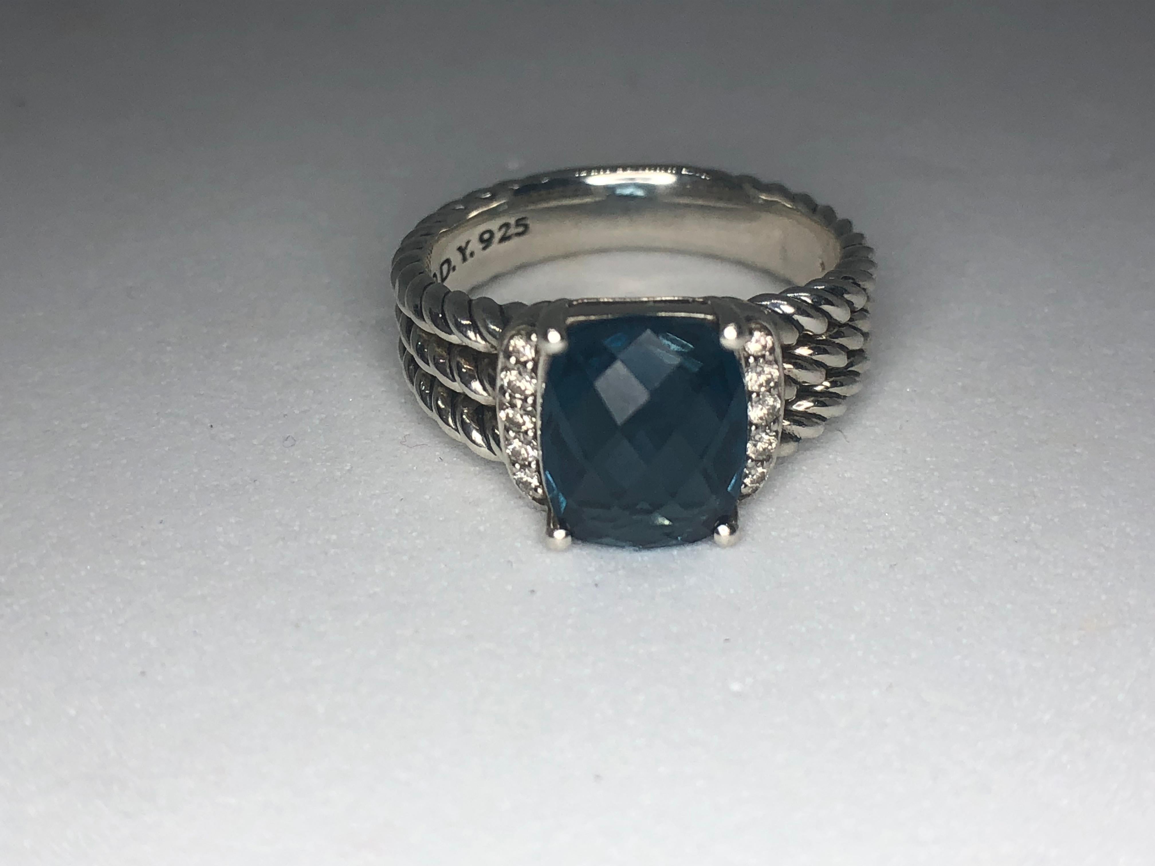 Lady's sterling silver london blue topaz ring accompanied by 10 diamonds by David Yurman. Style is 