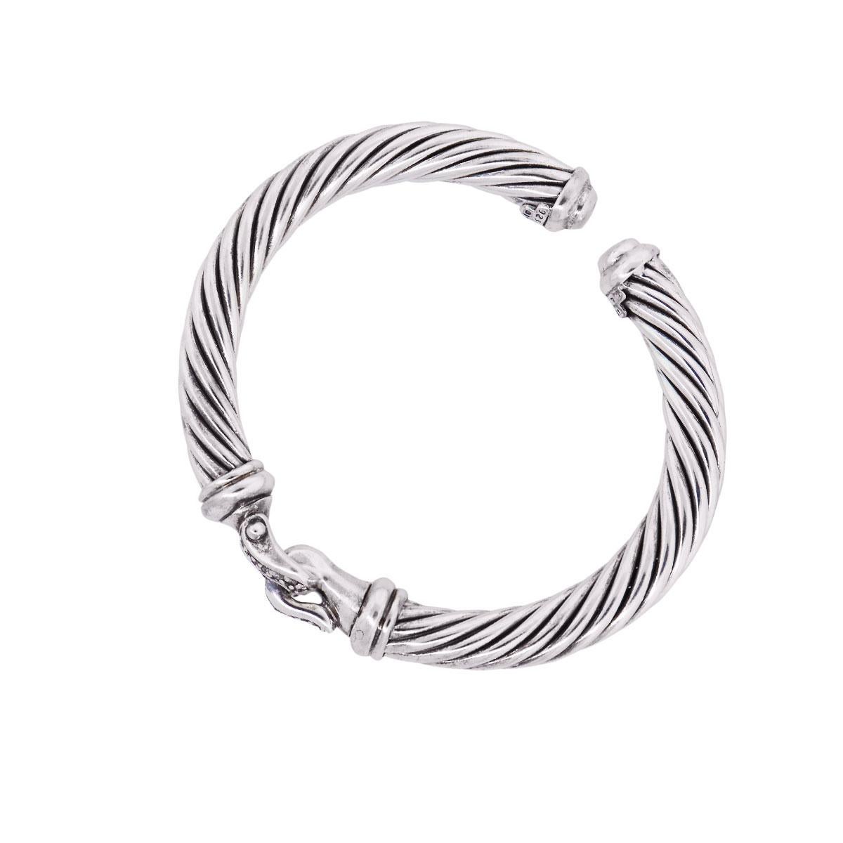 Designer: David Yurman
Material: Sterling silver
Diamond Details: Approximately 0.20ctw of round brilliant diamonds. Diamonds are G/H in color and VS in clarity
Total Weight: 43g (27.6dwt)
Bracelet Measurements: Will fit a 6″ wrist
Clasp Details:
