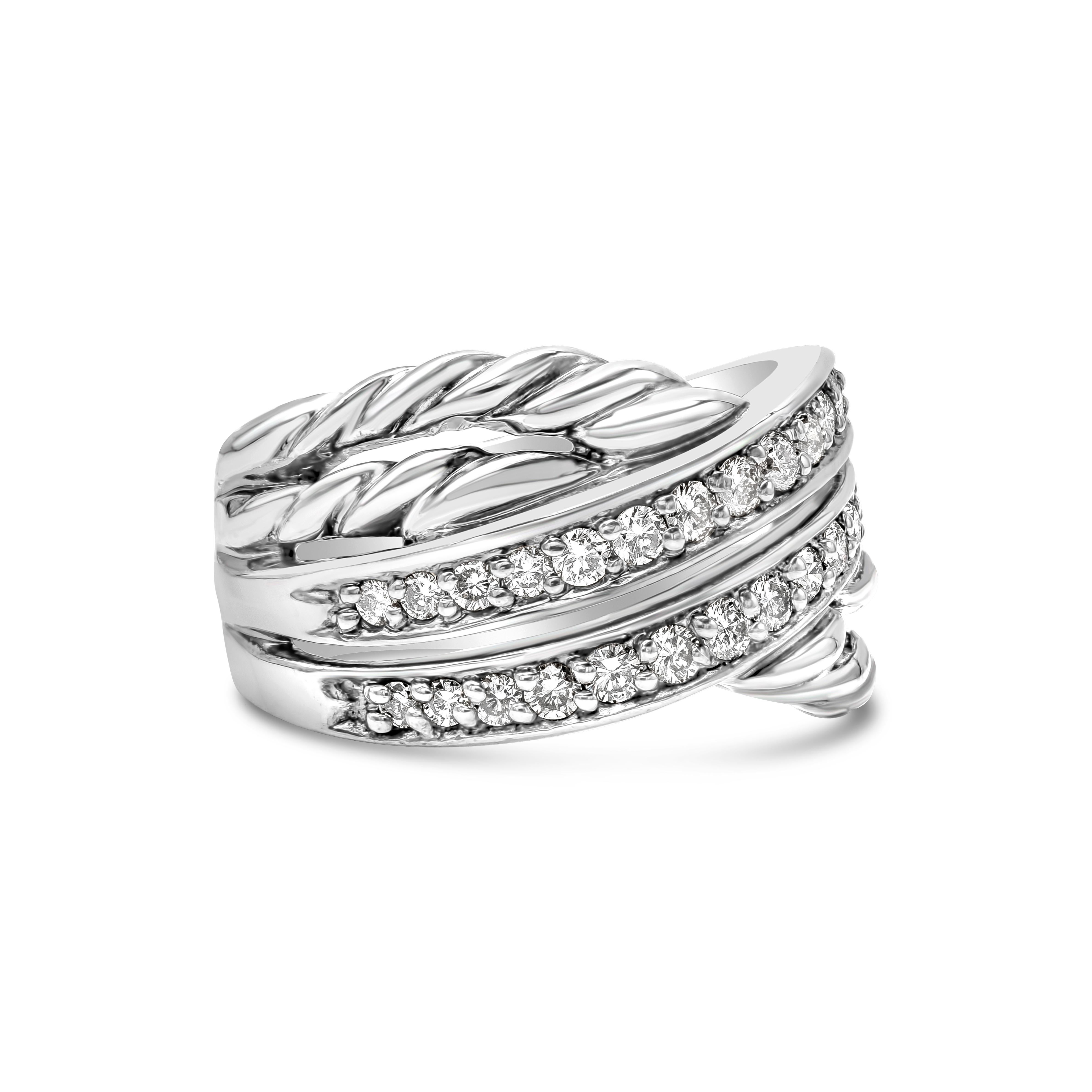 Showcasing a row of round brilliant diamonds that crossover to a rope design made in sterling silver. Diamonds weigh approximately 0.50 carats total. Made and stamped by David Yurman. Size 6 US resizable upon request and 12.2 mm in width.

