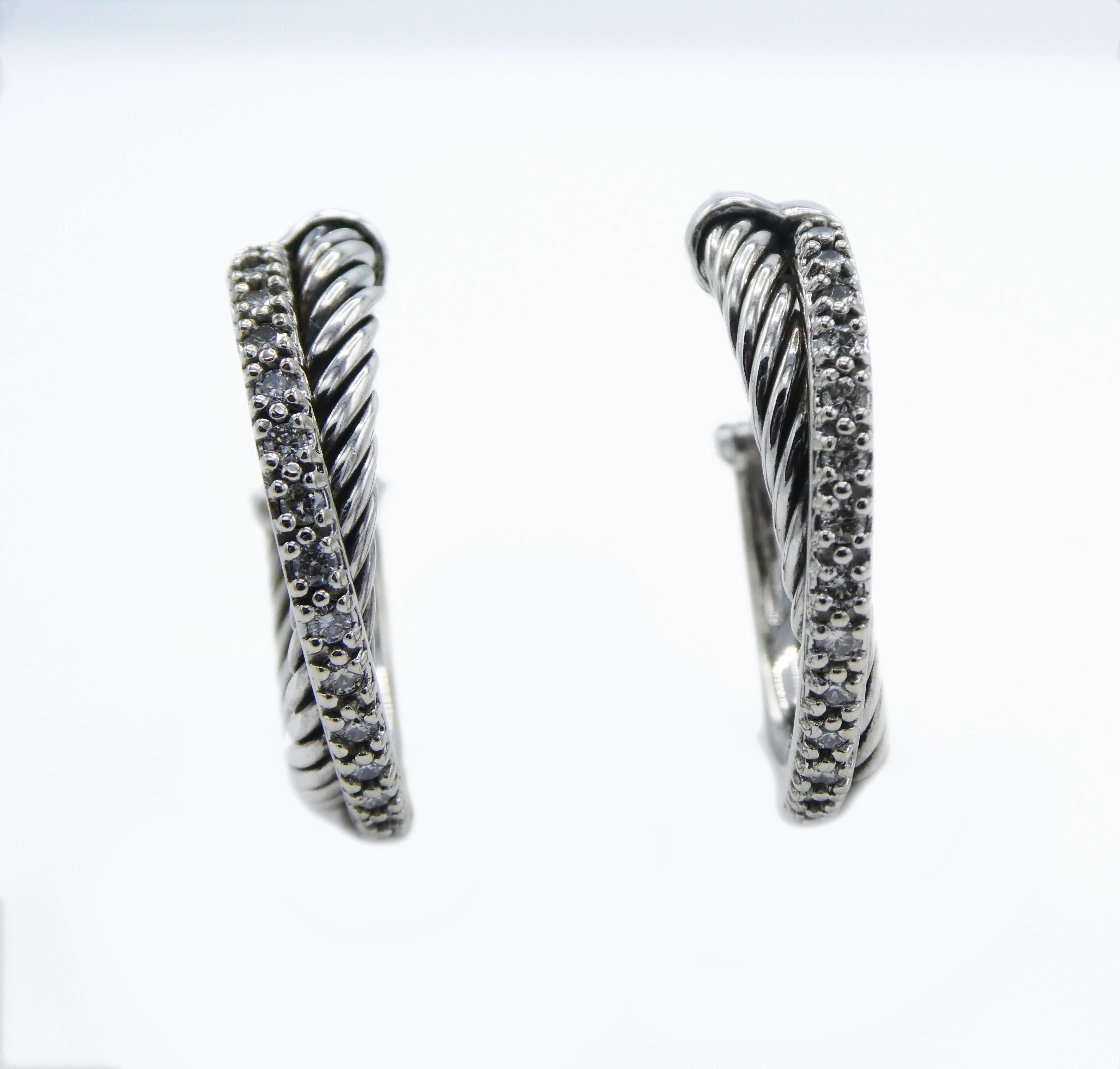 David Yurman Diamond Hoop Cable Crossover Earrings Sterling Silver & White Gold
Metal: Sterling silver 925, 14k White Gold 585
Weight: 8.24 grams
Diamonds: 34 Round Brilliant Cut Diamonds approx. 0.31ctw
approx. 25mm in diameter
Signed: D.Y. 925