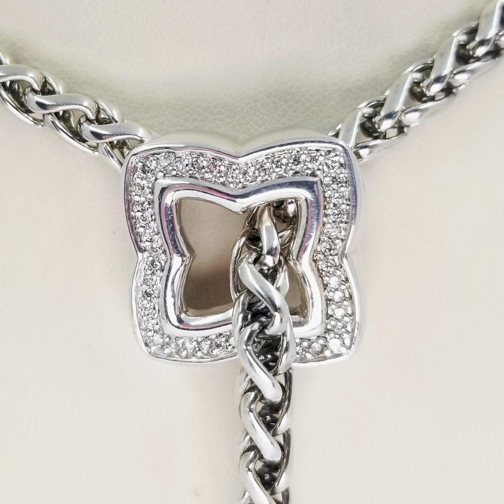 Sterling silver and diamond lariat necklace from the David Yurman Quatrefoil collection. The adjustable lariat extends up to 18 inches in length, and locks into place behind the pendant. Quatrefoil pendant features 44 round brilliant cut diamonds.