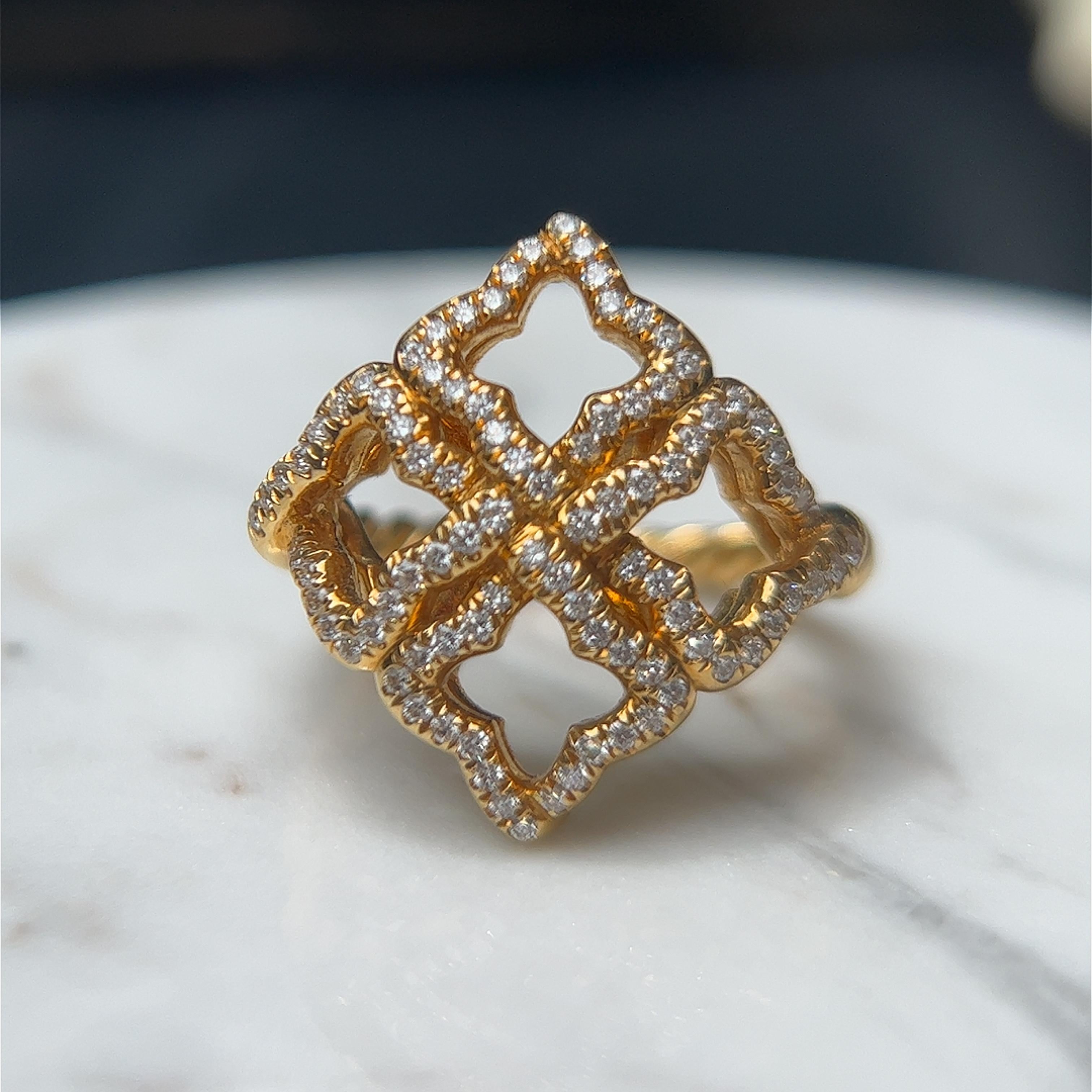 One David Yurman Quatrefoil 18 karat yellow gold ring set with ninety-two round brilliant cut diamonds, approximately 1.00 carat total weight with matching G/H color and VS1 clarity. The ring is stamped D. Y 750 and is a finger size 6.25.

